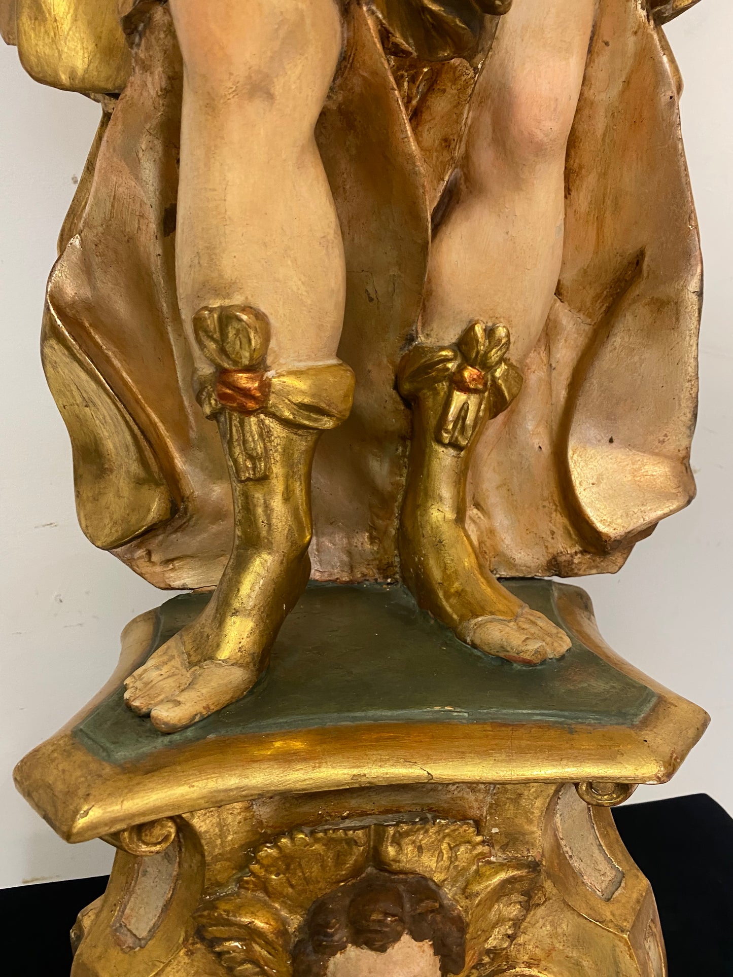 Angel candle holder lacquered gold in carved wood. Central Italy first half of the 17th century. Height 124 cm