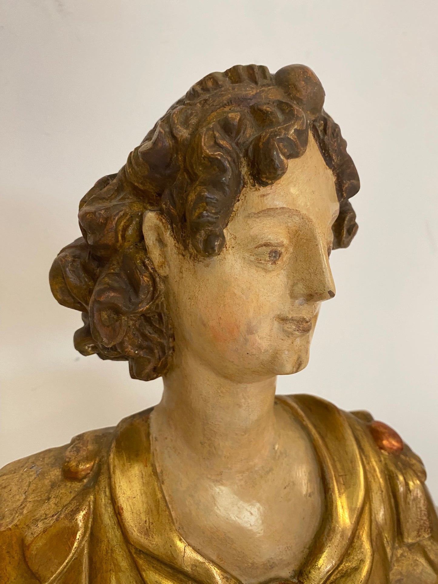 Angel candle holder lacquered gold in carved wood. Central Italy first half of the 17th century. Height 124 cm