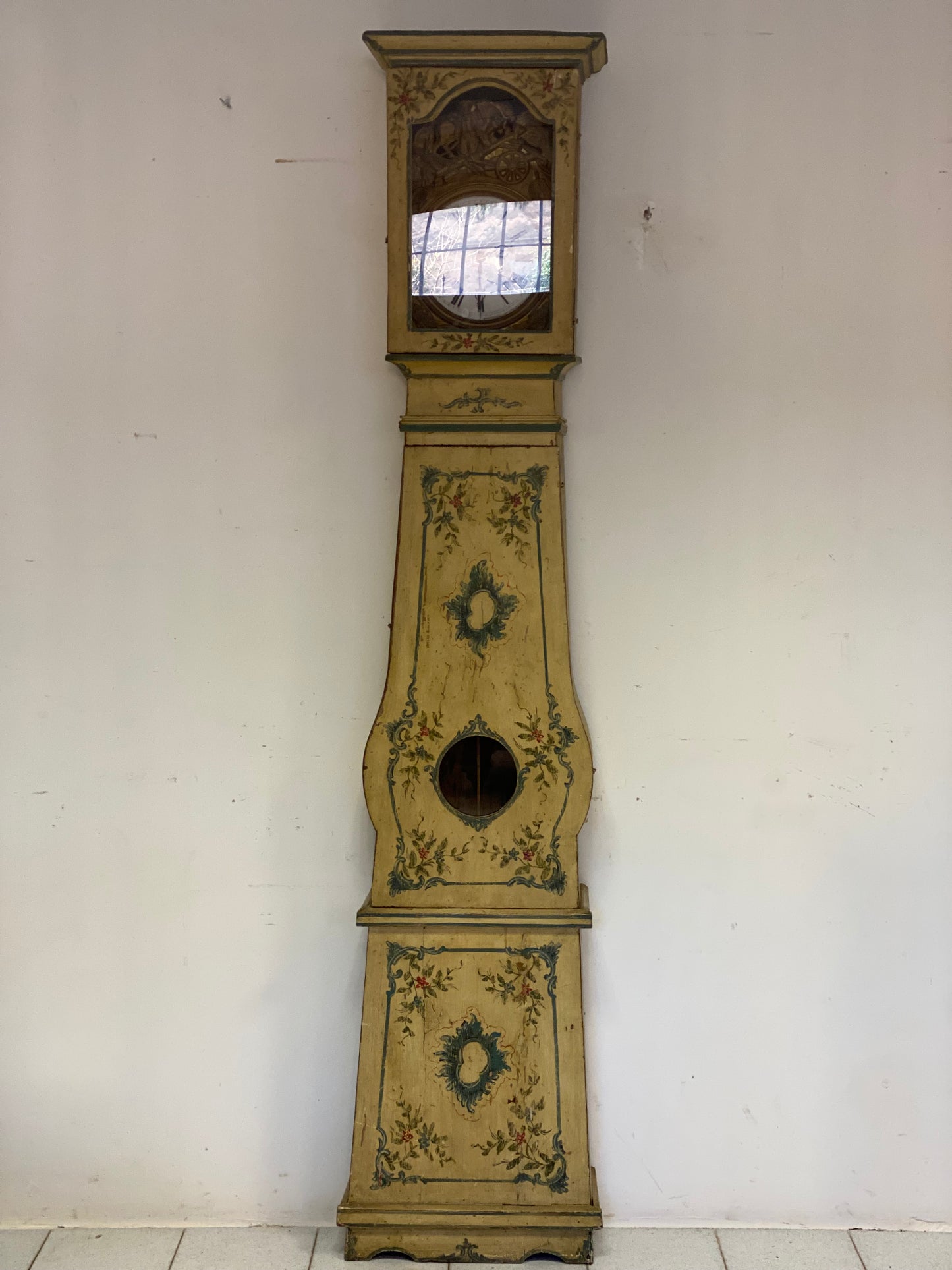 Lacquered and painted pendulum clock. 19th century