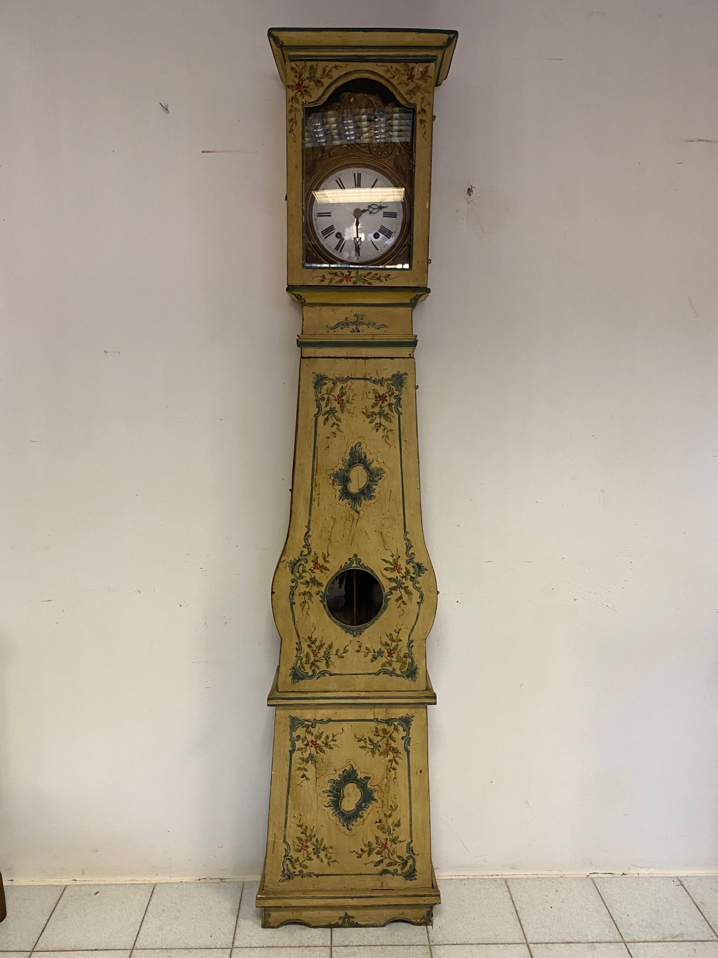 Lacquered and painted pendulum clock. 19th century