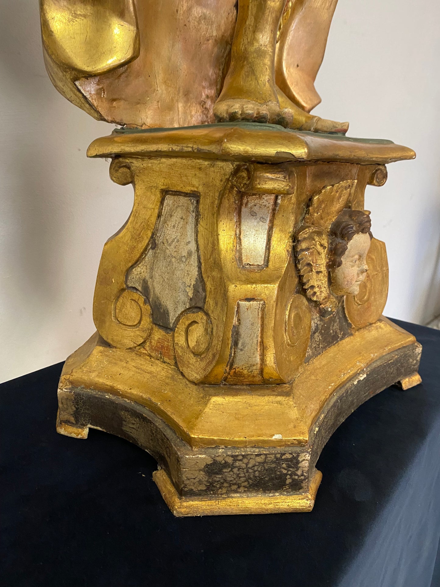 Angel candle holder lacquered gold in carved wood. Central Italy first half of the 17th century. Height 124 cm