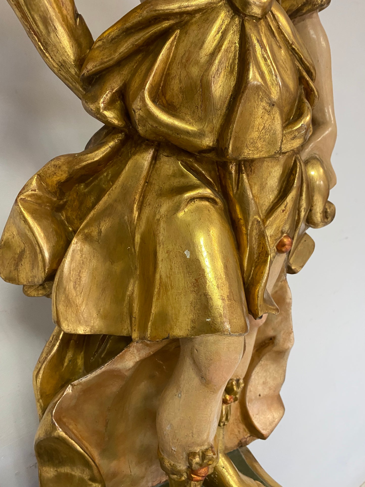 Angel candle holder lacquered gold in carved wood. Central Italy first half of the 17th century. Height 124 cm
