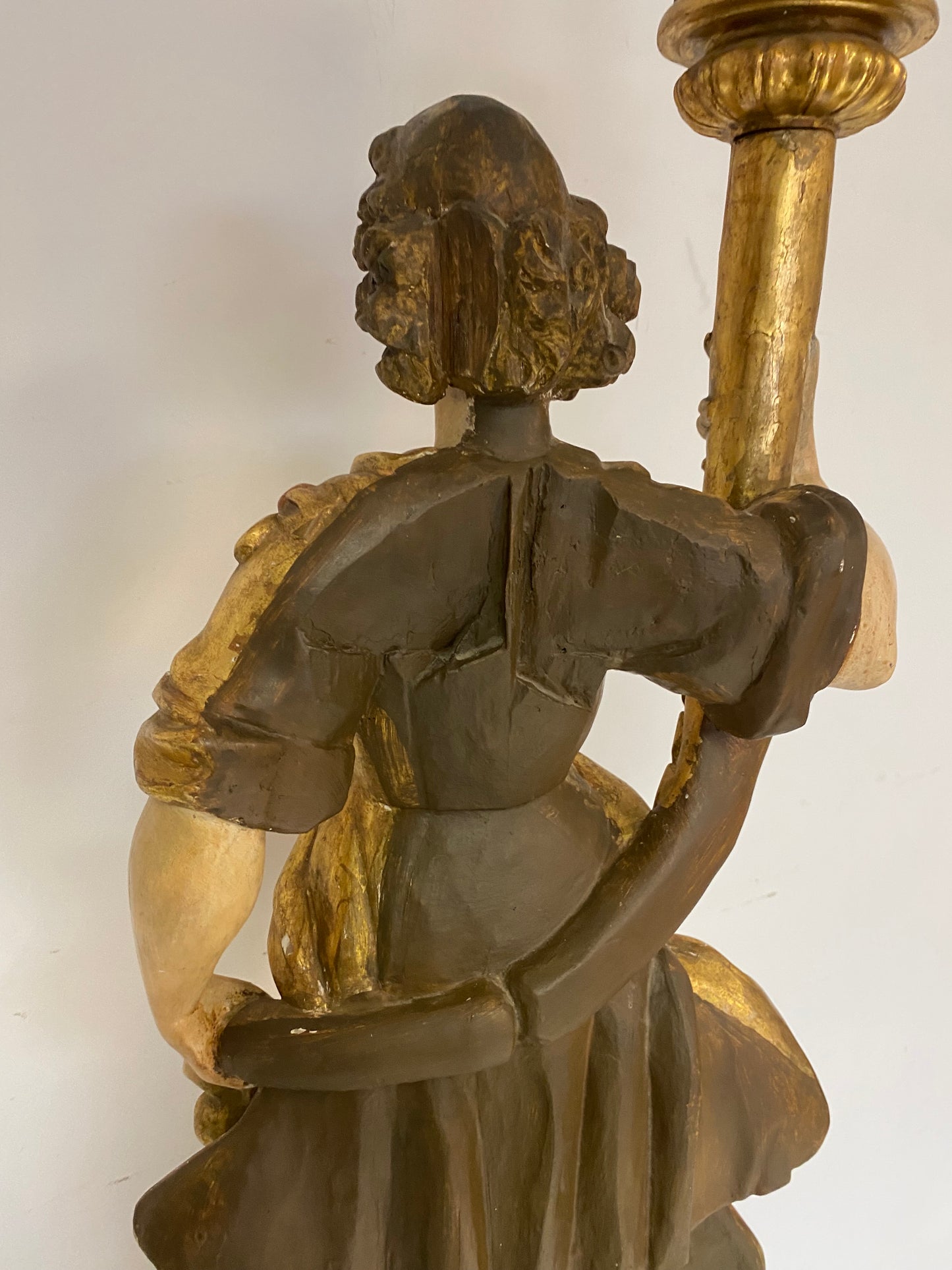 Angel candle holder lacquered gold in carved wood. Central Italy first half of the 17th century. Height 124 cm
