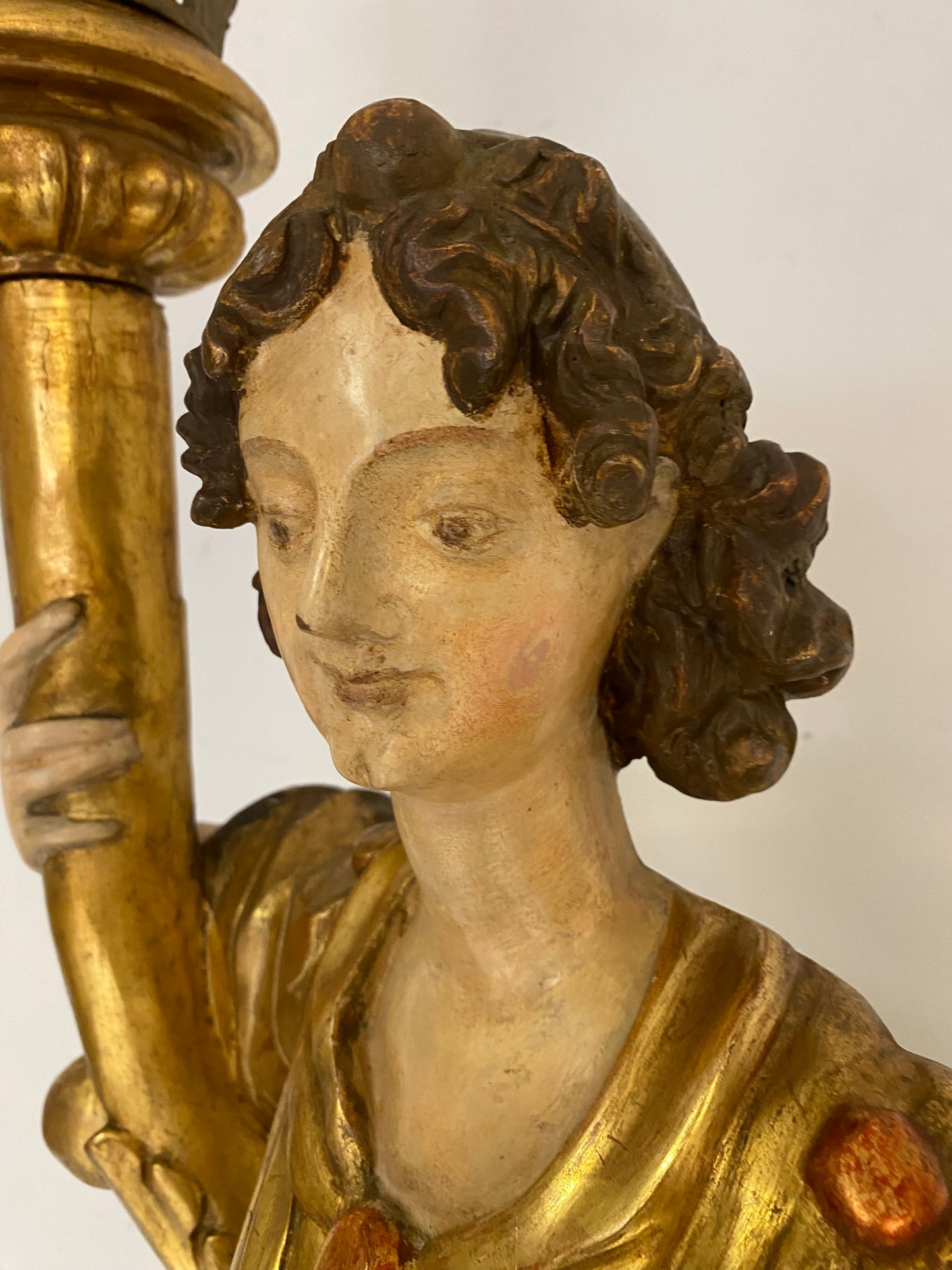 Angel candle holder lacquered gold in carved wood. Central Italy first half of the 17th century. Height 124 cm