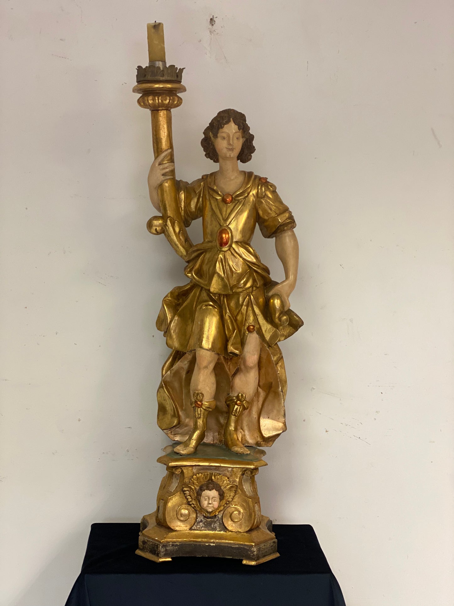 Angel candle holder lacquered gold in carved wood. Central Italy first half of the 17th century. Height 124 cm