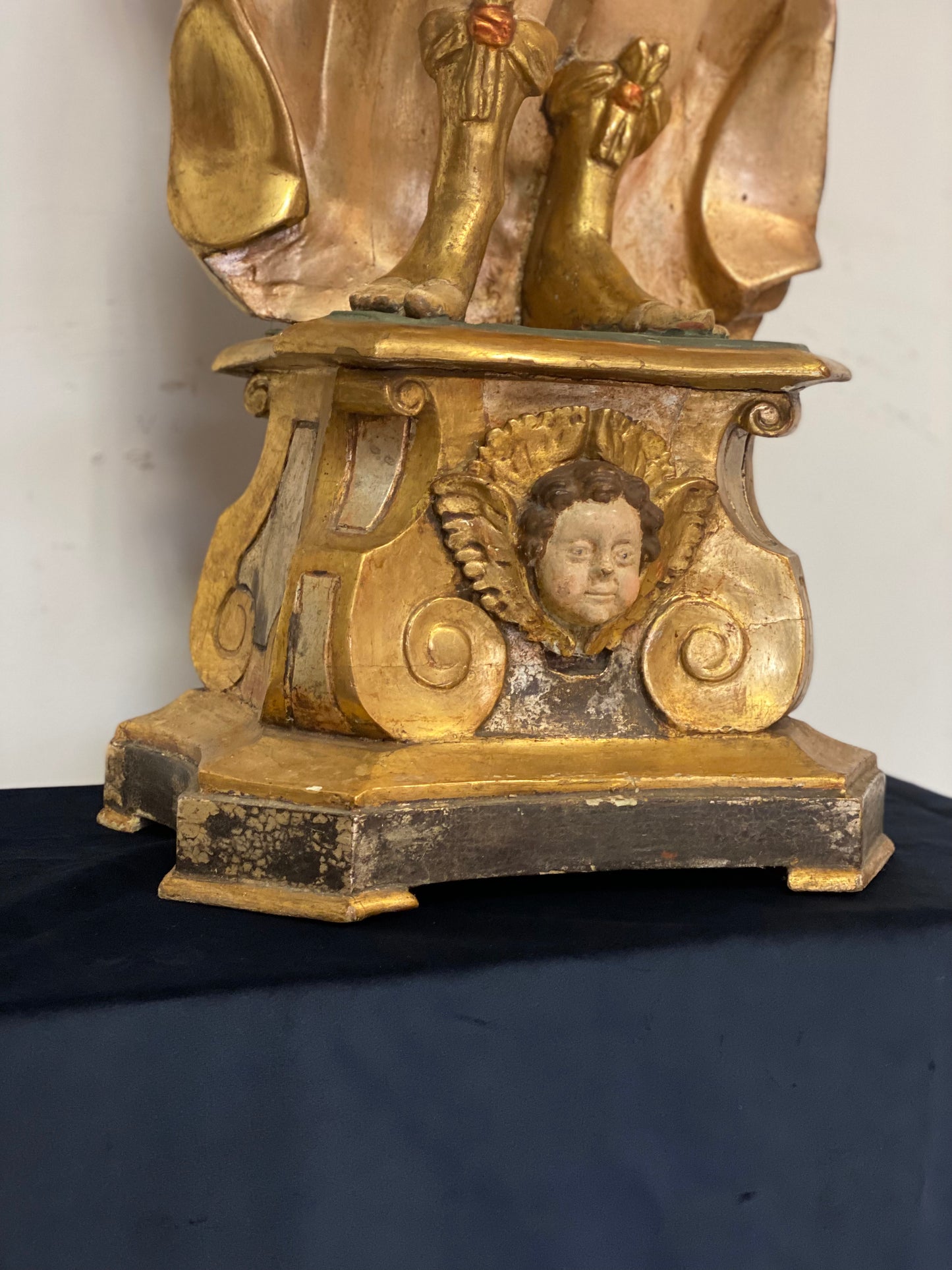 Angel candle holder lacquered gold in carved wood. Central Italy first half of the 17th century. Height 124 cm