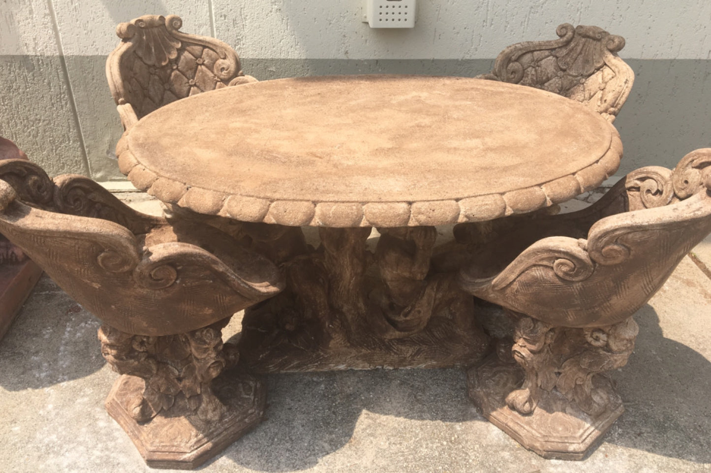 Oval table with cherubs and tub chairs. 1950s