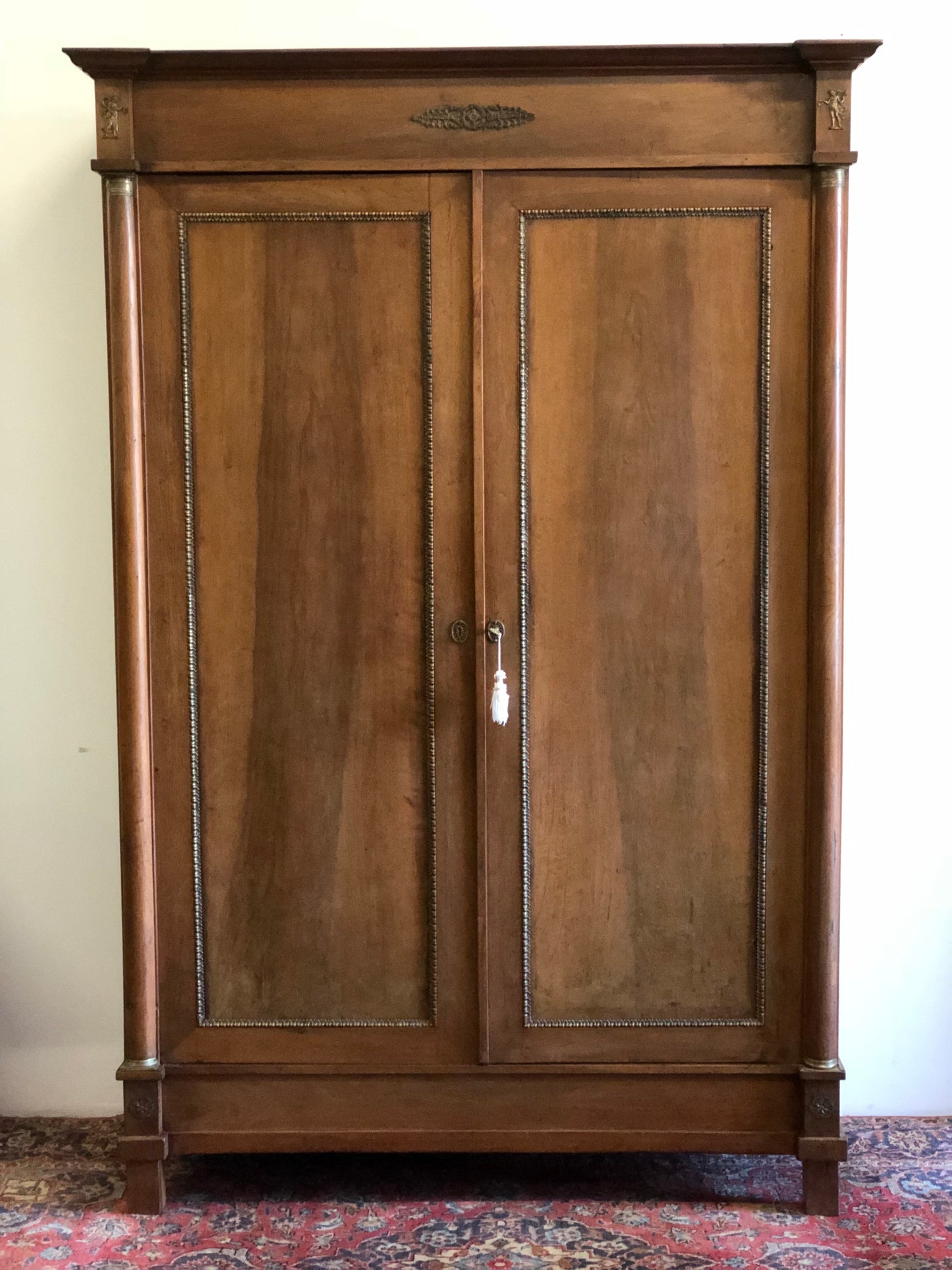 Empire period walnut wardrobe with half columns
