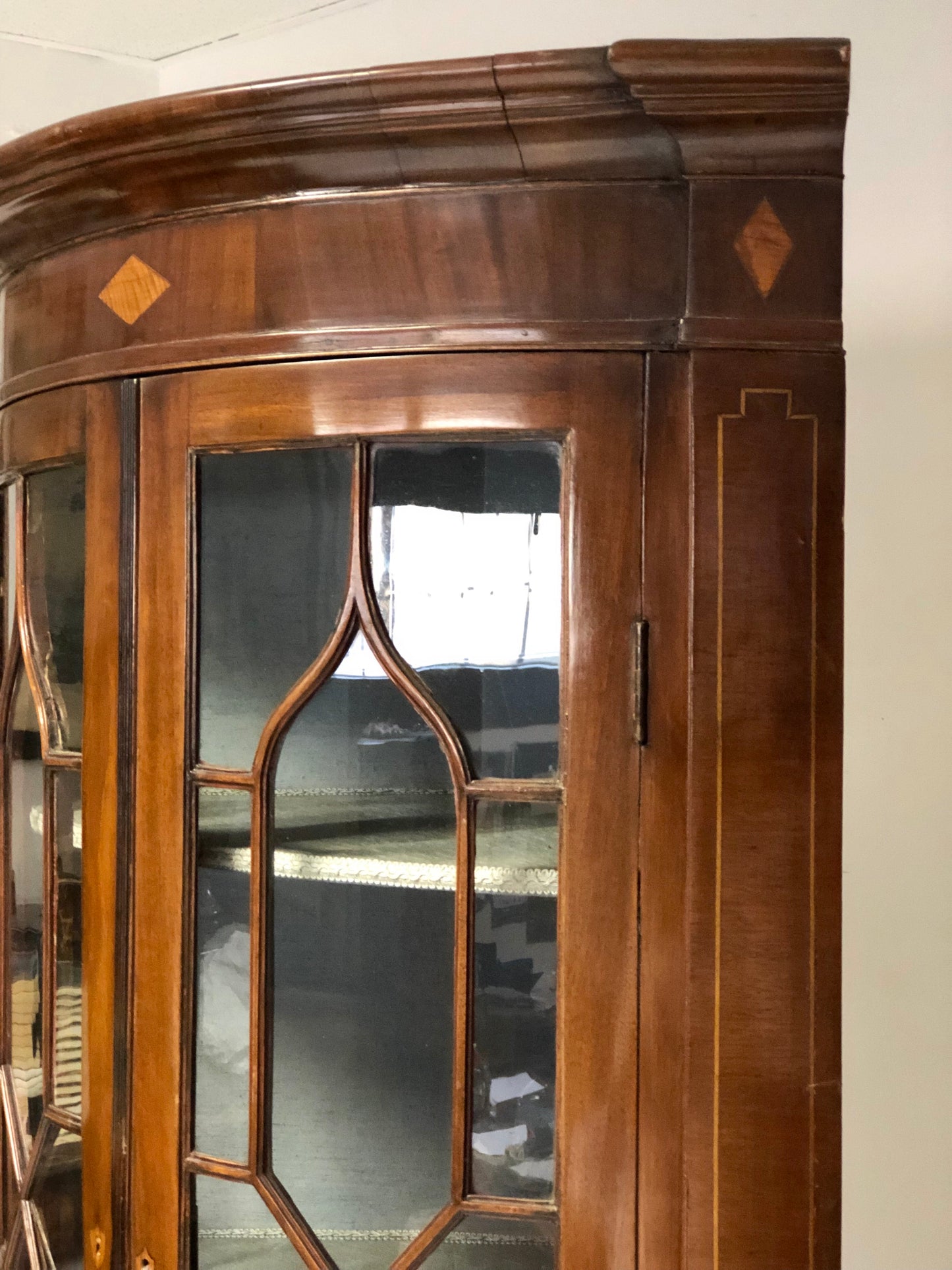 Inlaid curved corner cabinet, mid 19th century