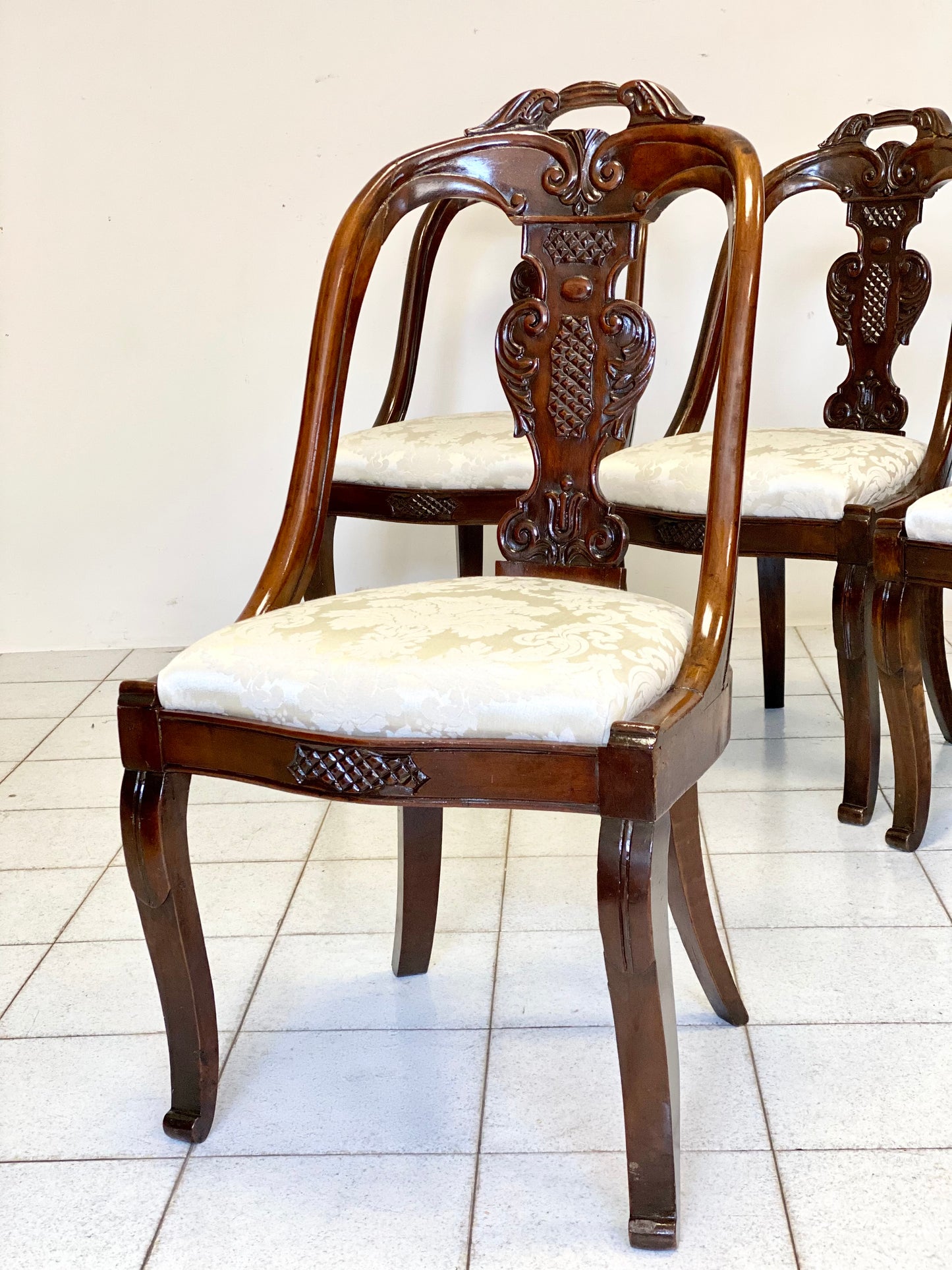 Group of four Lombard Charles X gondola empire chairs. Early 19th century
