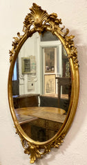 Specchiera ovale in foglia oro . Lombardia XIX secolo