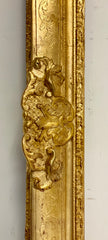 Grande cornice in legno intagliato dorato . XIX secolo