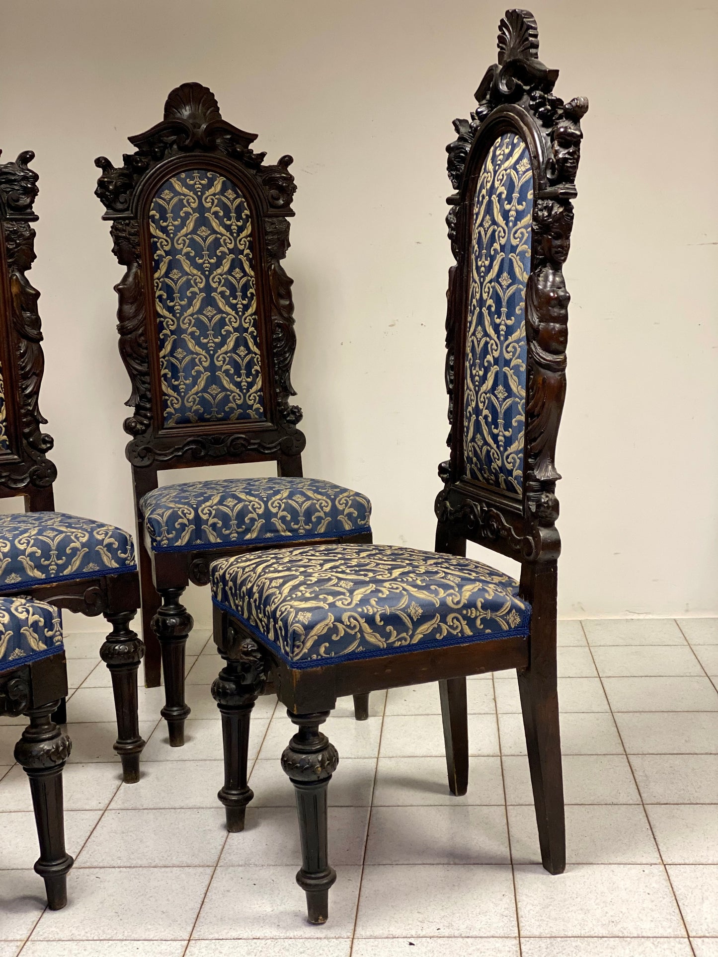 Group of four carved walnut chairs. Bergamo, early 19th century
