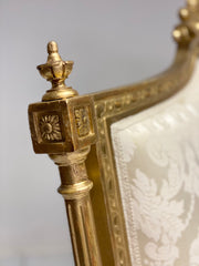Divano intagliato e dorato in foglia oro . Inizio XIX secolo