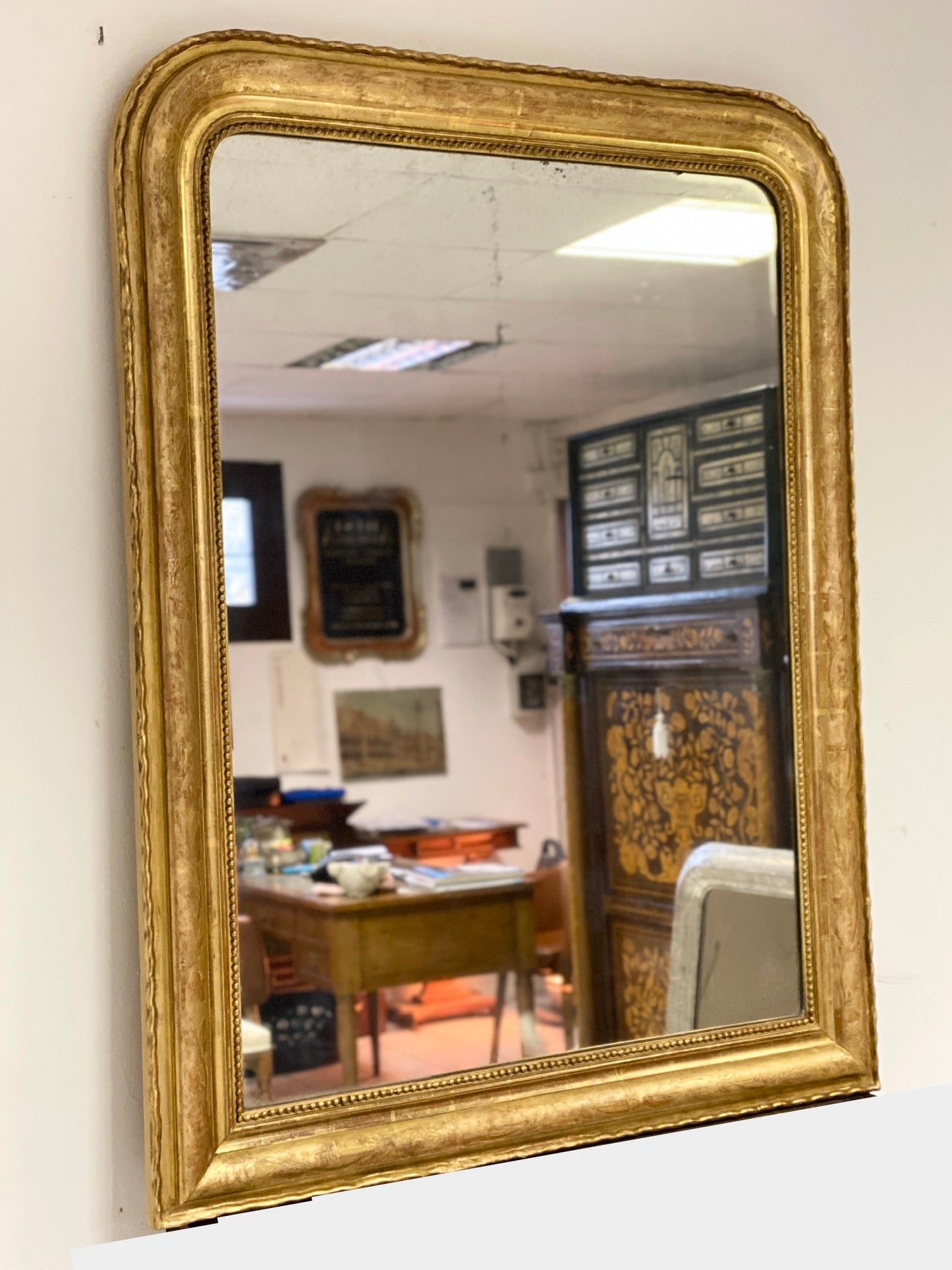 Charles X mirror in pure gold leaf. 19th century. Restored