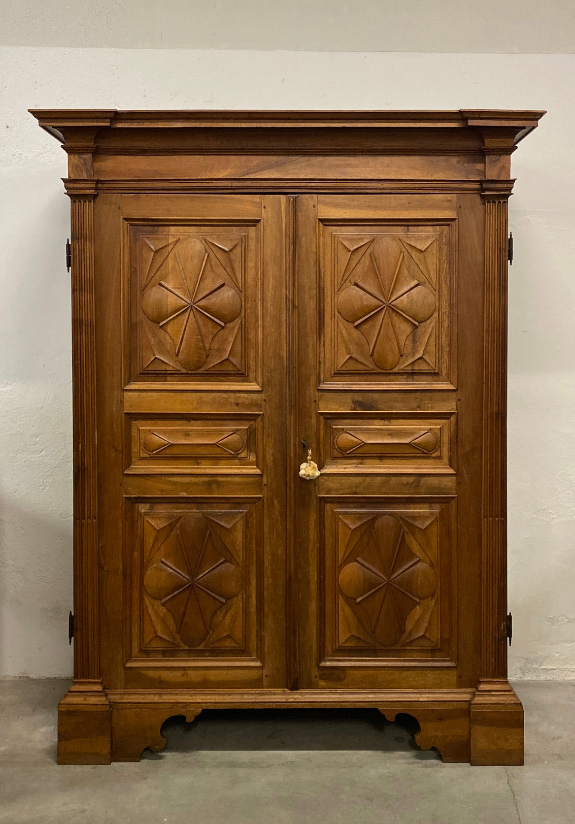 Walnut wardrobe carved with cloverleaf Genoa mid 18th century