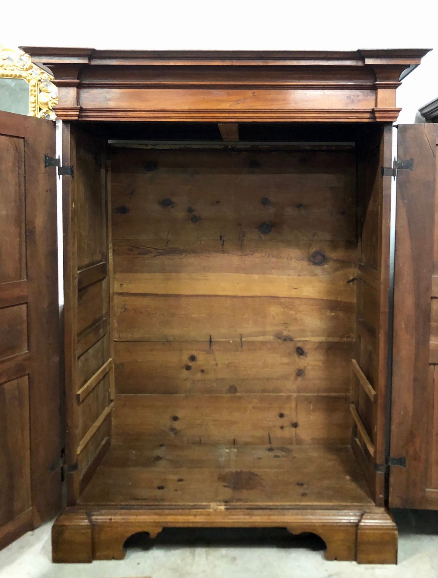Walnut wardrobe carved with four-leaf clover Genoa late 17th century