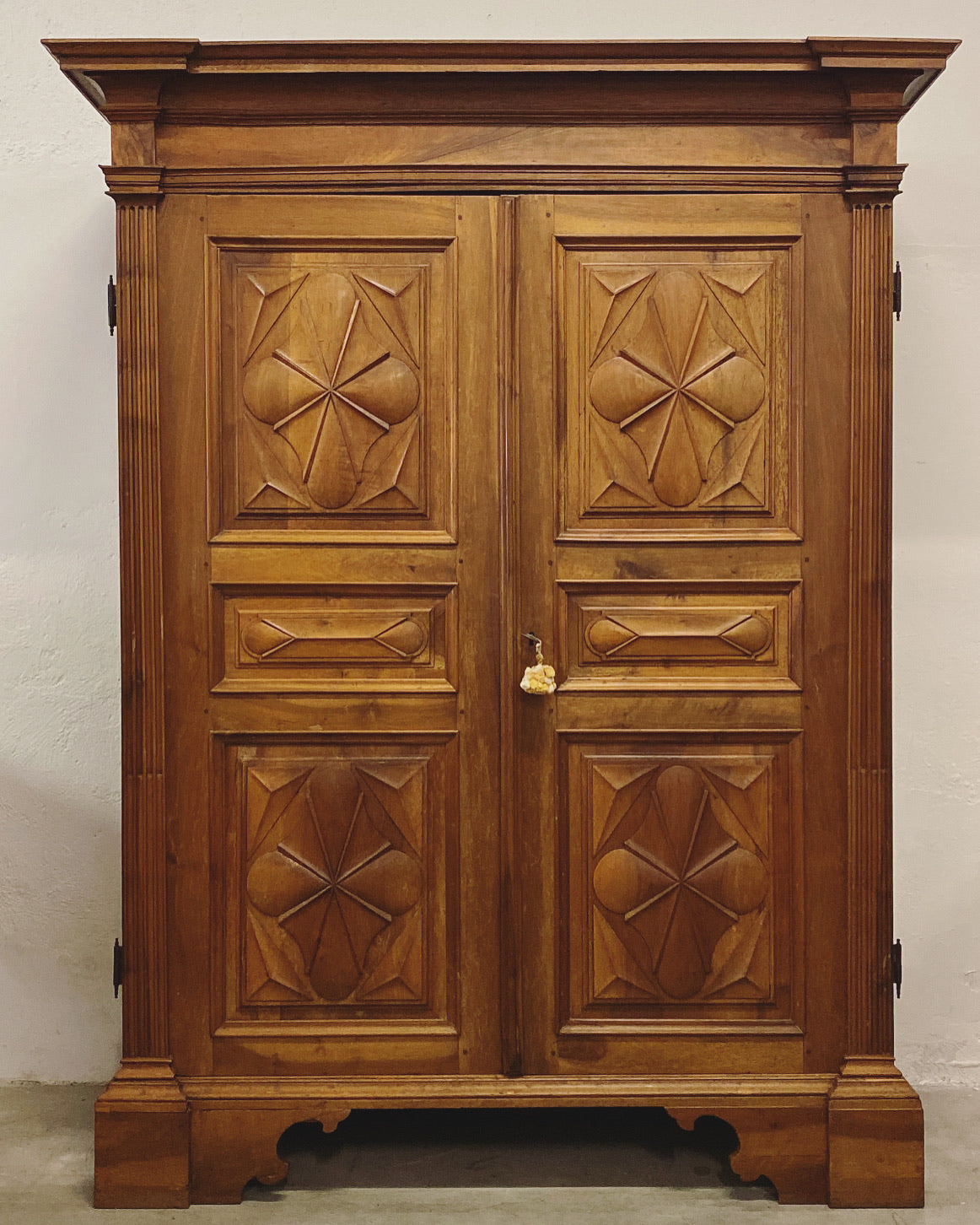 Walnut wardrobe carved with cloverleaf Genoa mid 18th century