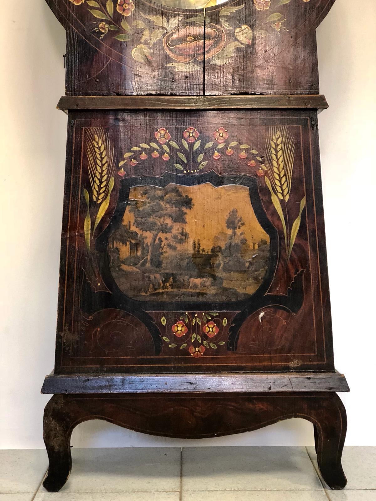 Lacquered and painted pendulum clock. 19th century