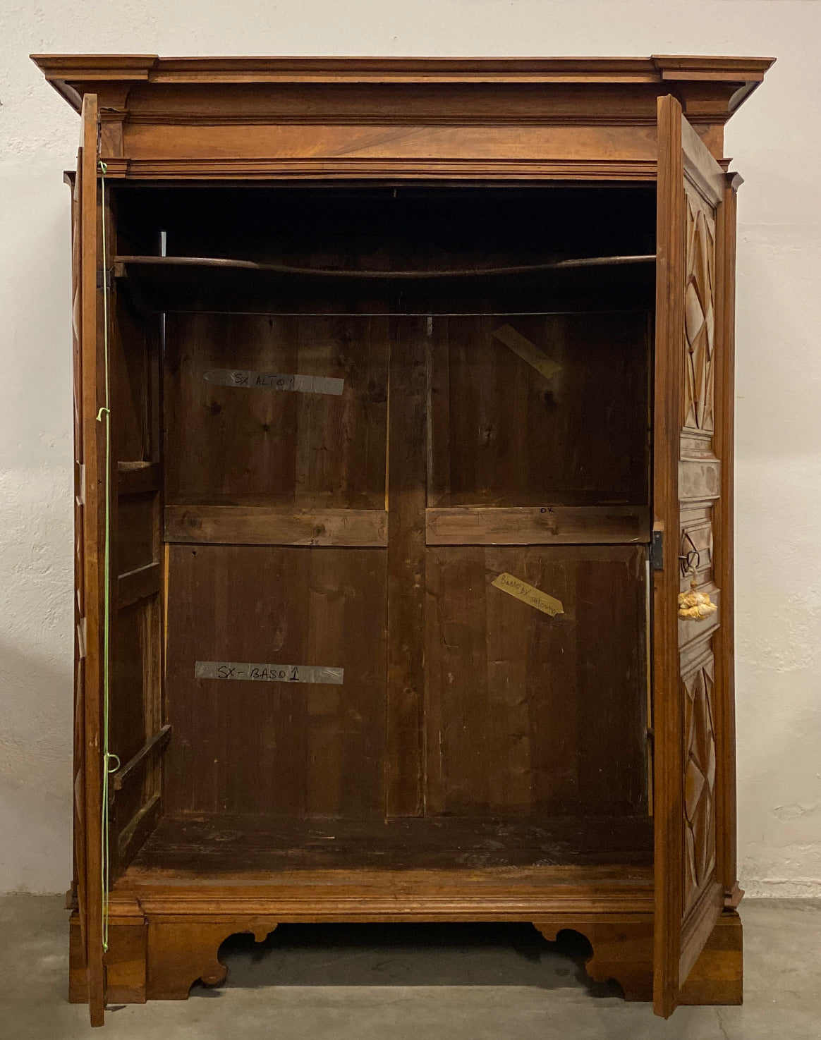Walnut wardrobe carved with cloverleaf Genoa mid 18th century