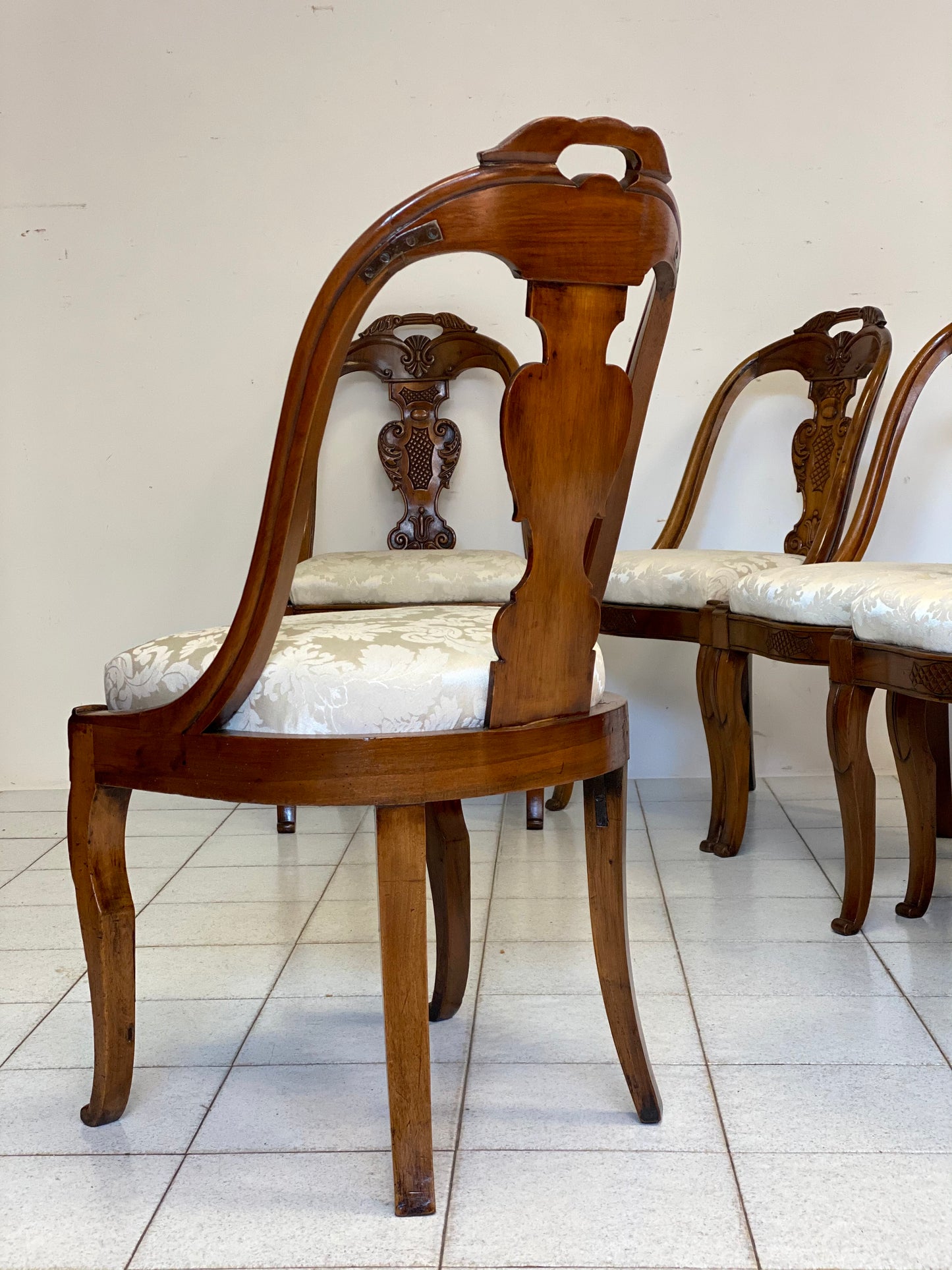 Group of six Lombard walnut gondola chairs. Charles X period