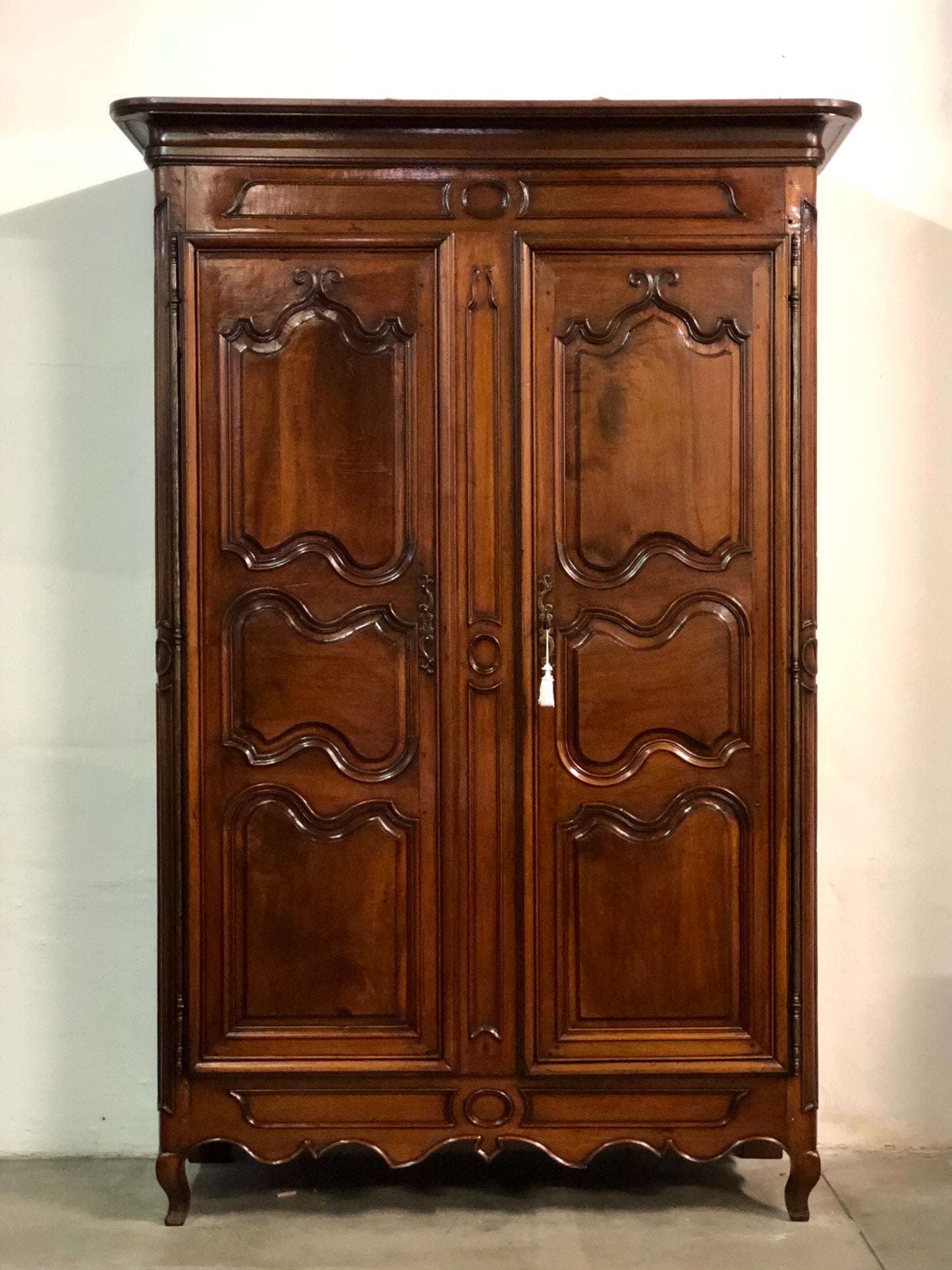 Louis XV carved walnut wardrobe.