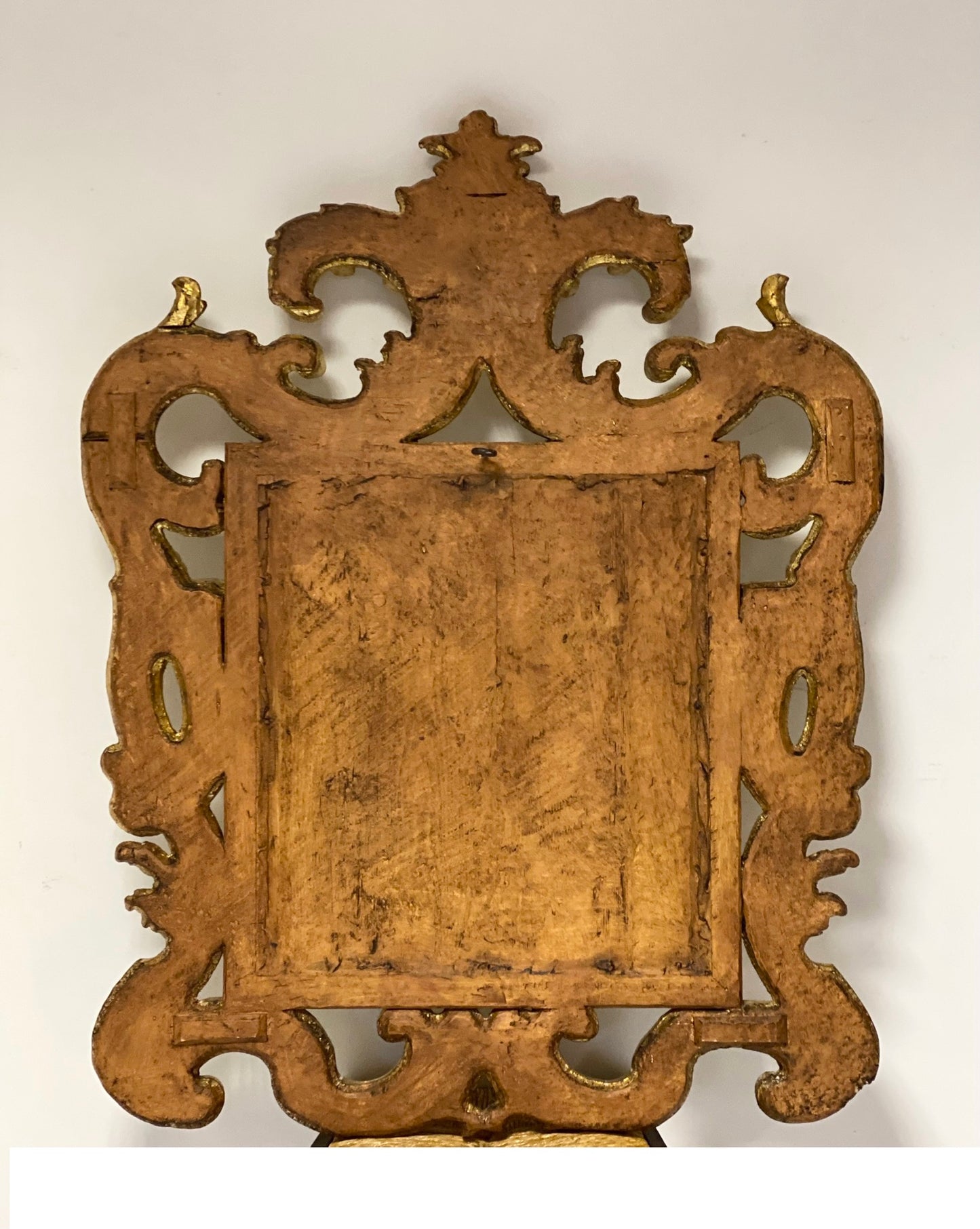 Gilded wooden mirror with scrolls. Emilia 19th century
