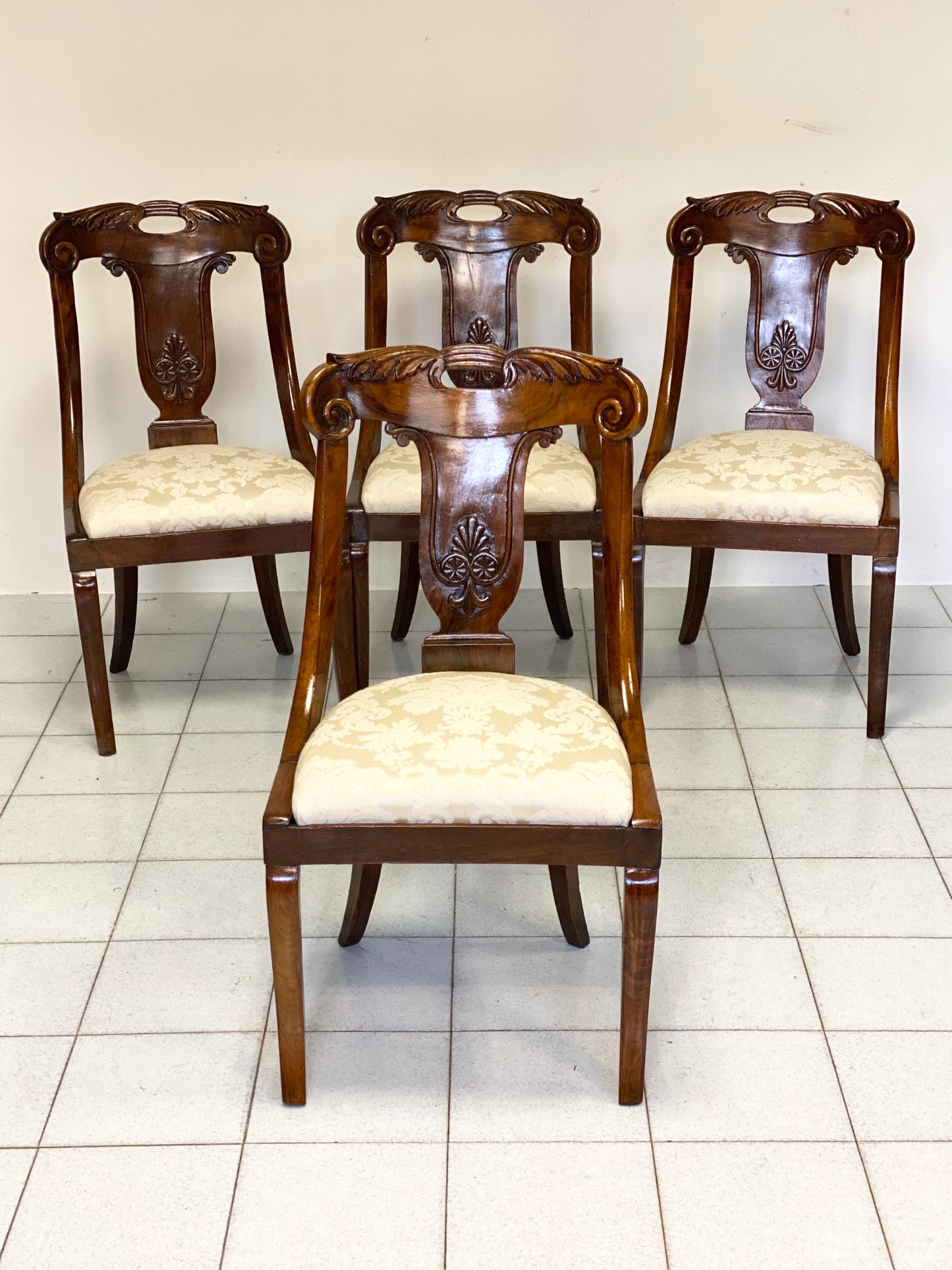 Group of four Empire gondola chairs Early 19th century
