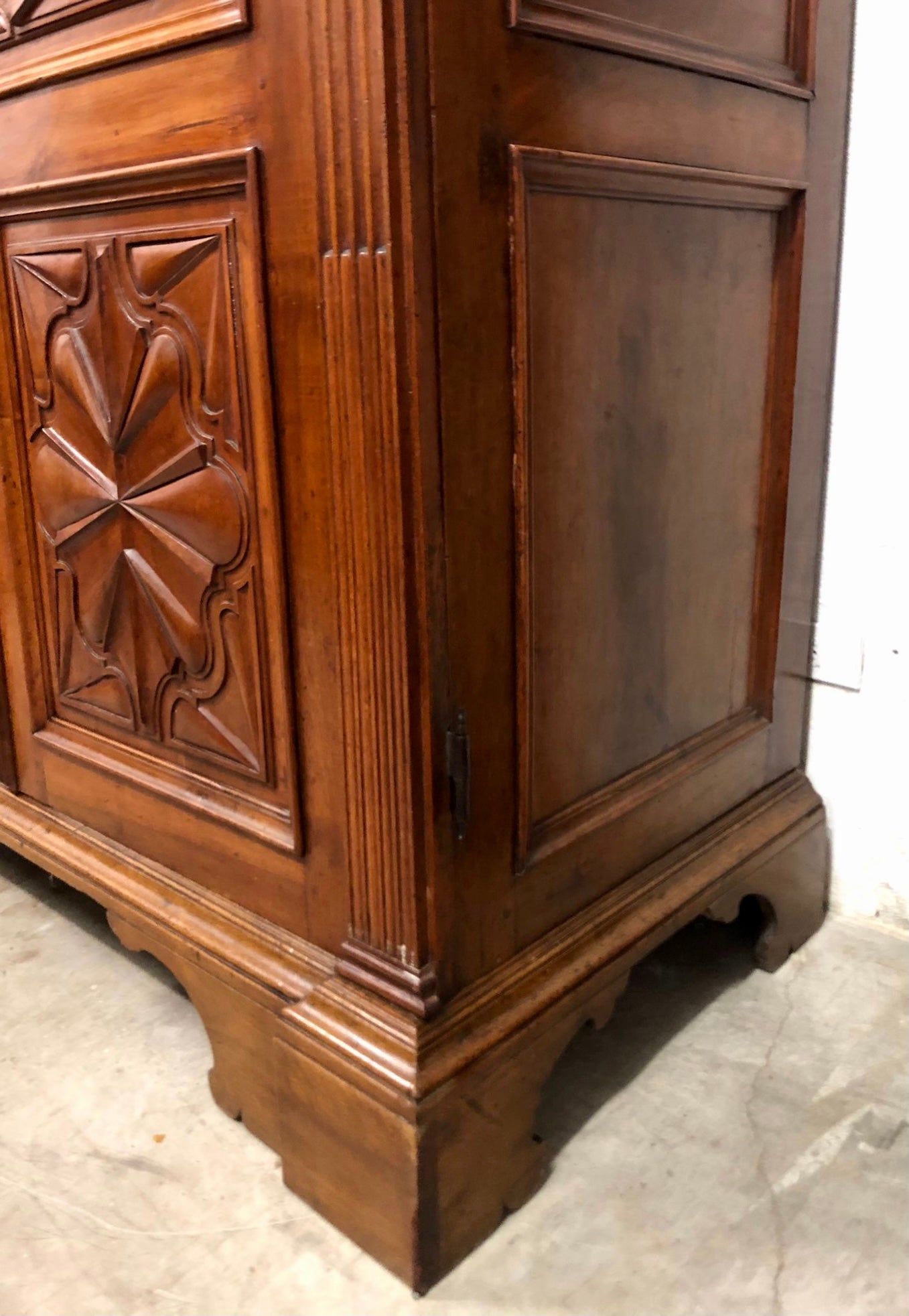 Walnut wardrobe carved with four-leaf clover Genoa late 17th century