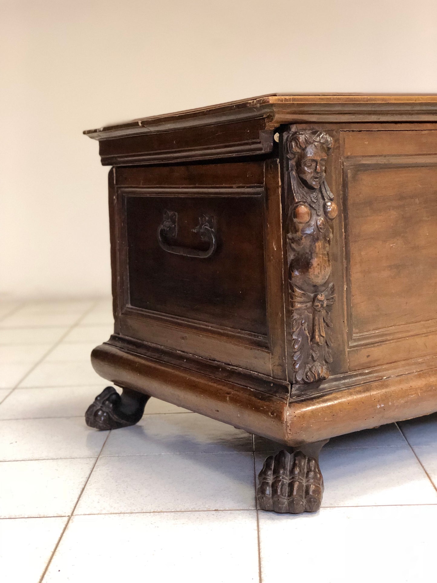 Walnut chest with carved caryatids and feral feet. Lombard 16th century