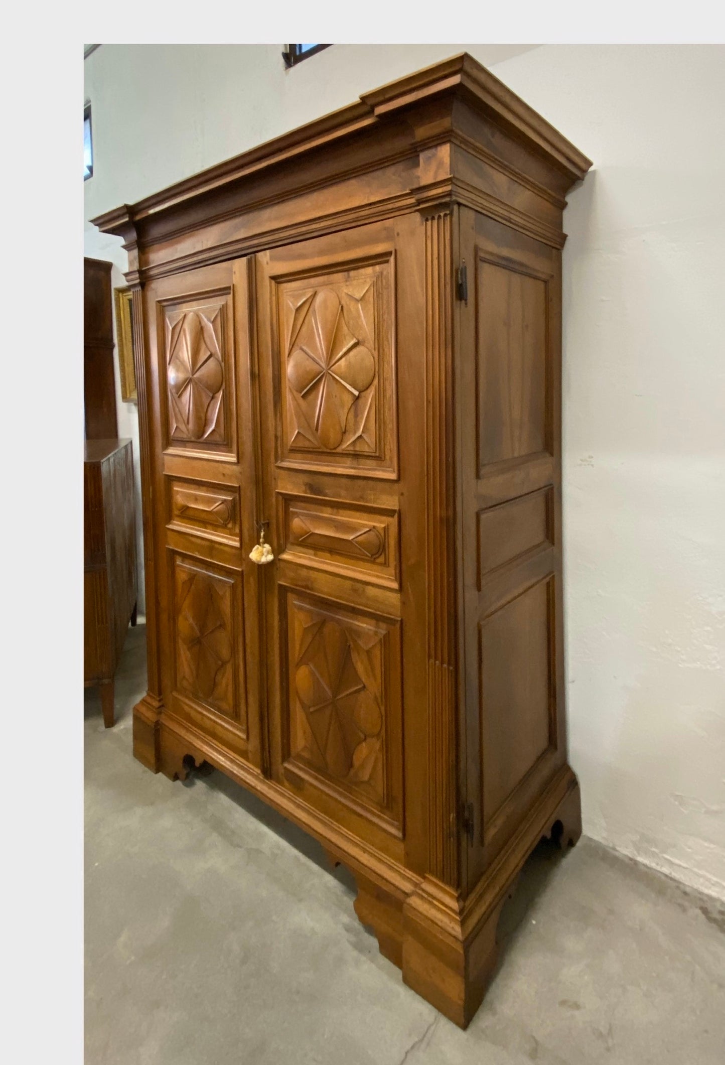 Walnut wardrobe carved with cloverleaf Genoa mid 18th century