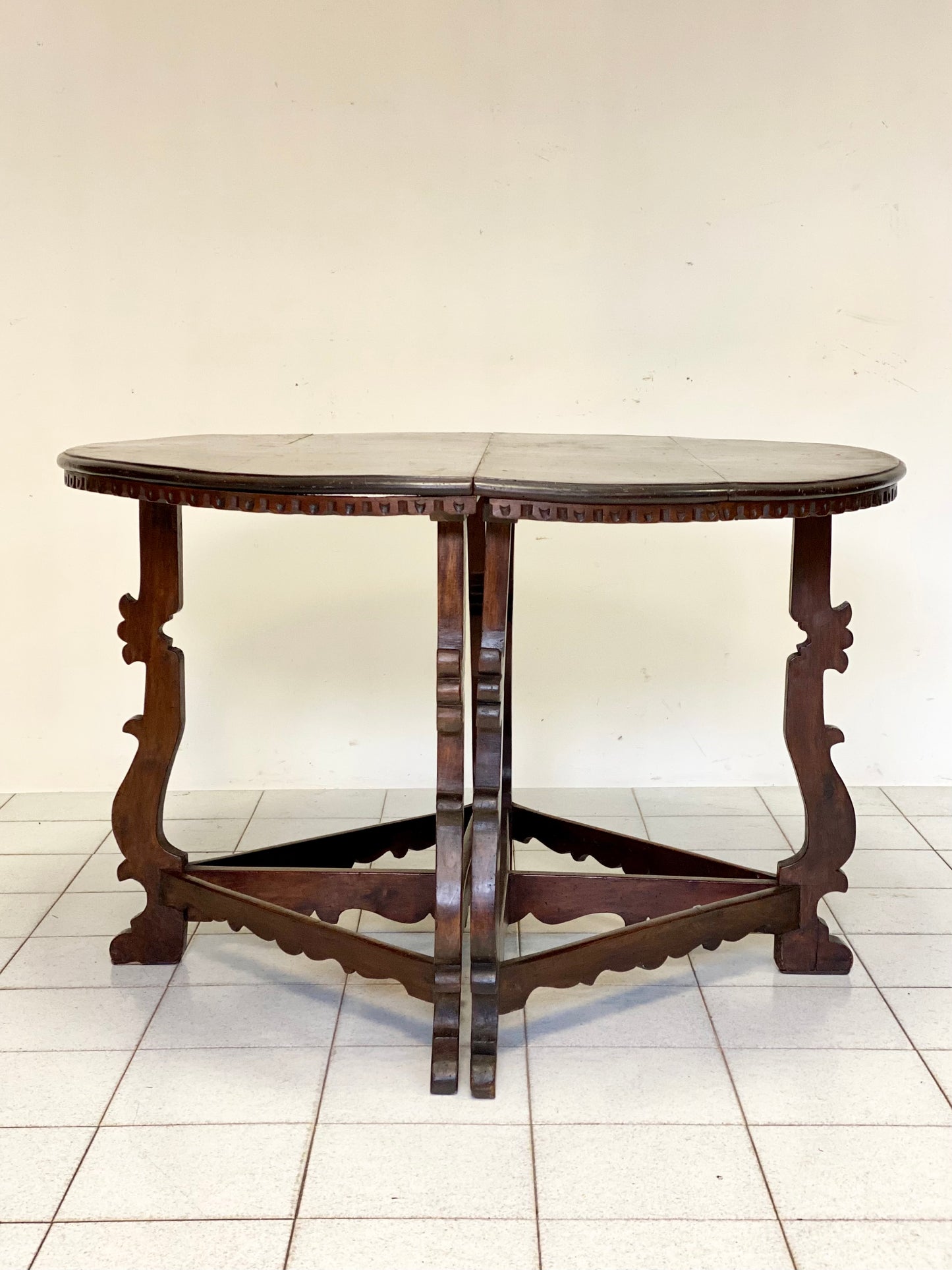 Pair of walnut lyre half-tables. Emilia 18th century