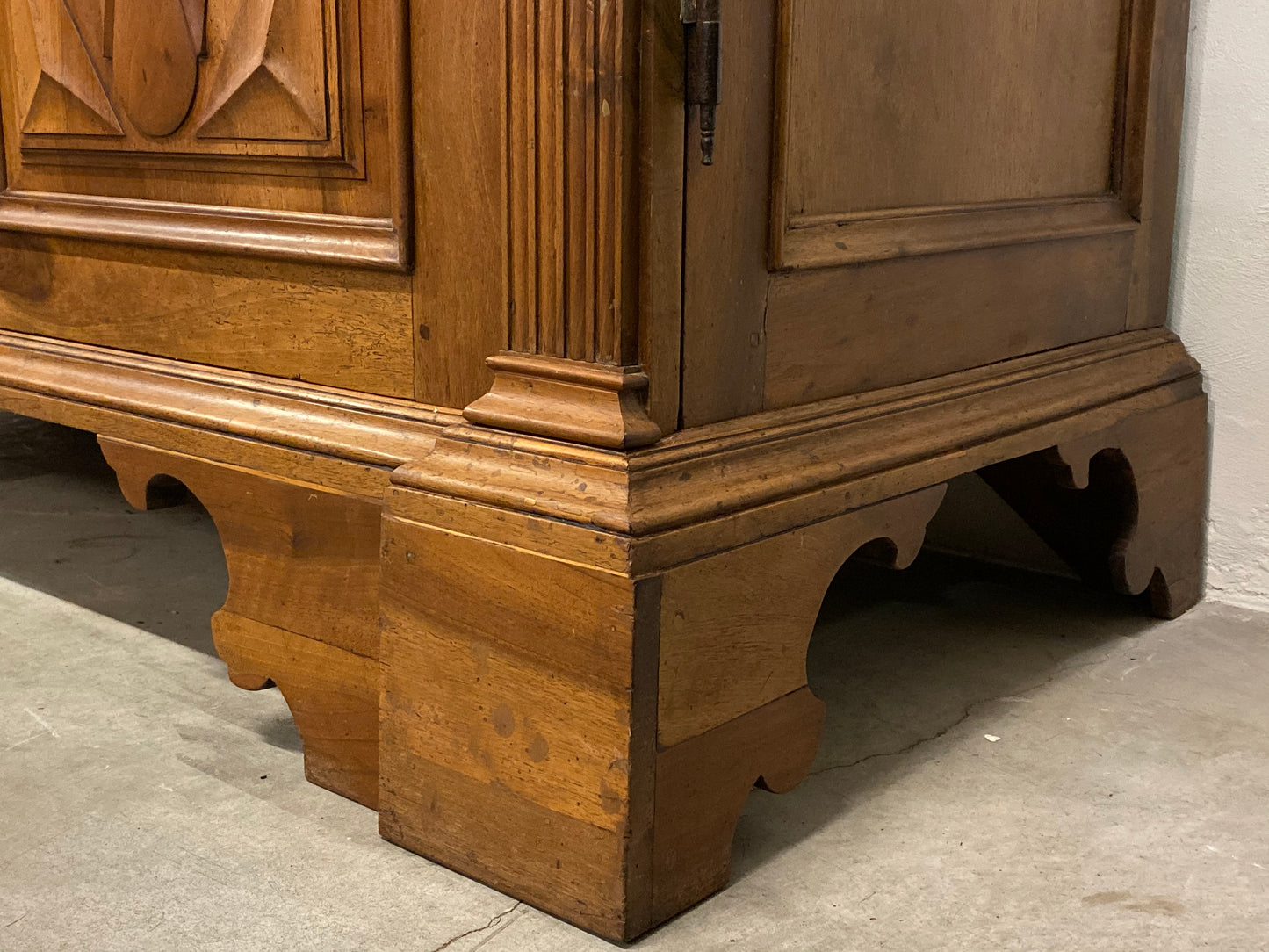 Walnut wardrobe carved with cloverleaf Genoa mid 18th century