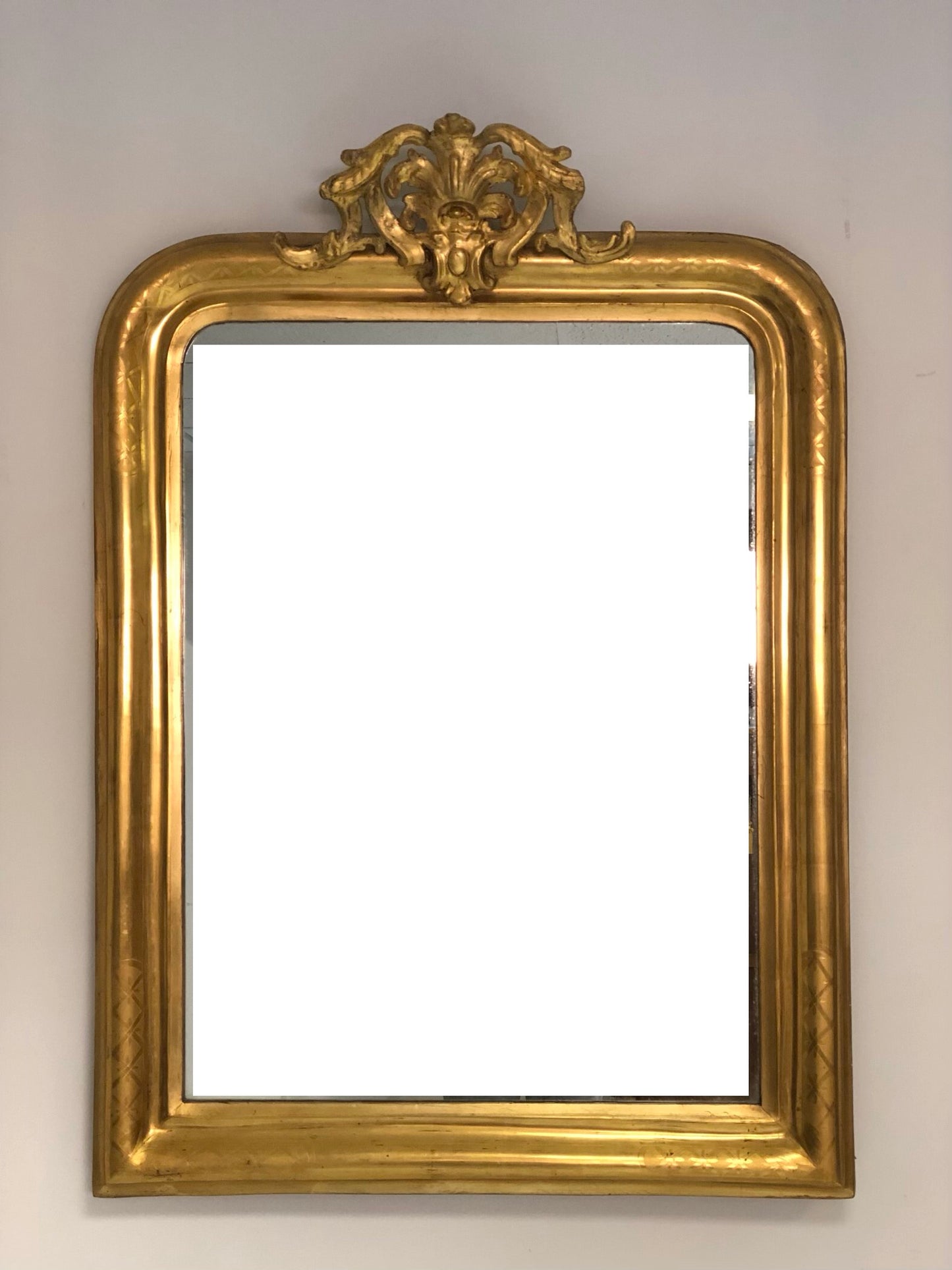 Mirror in pure gold leaf with perforated top