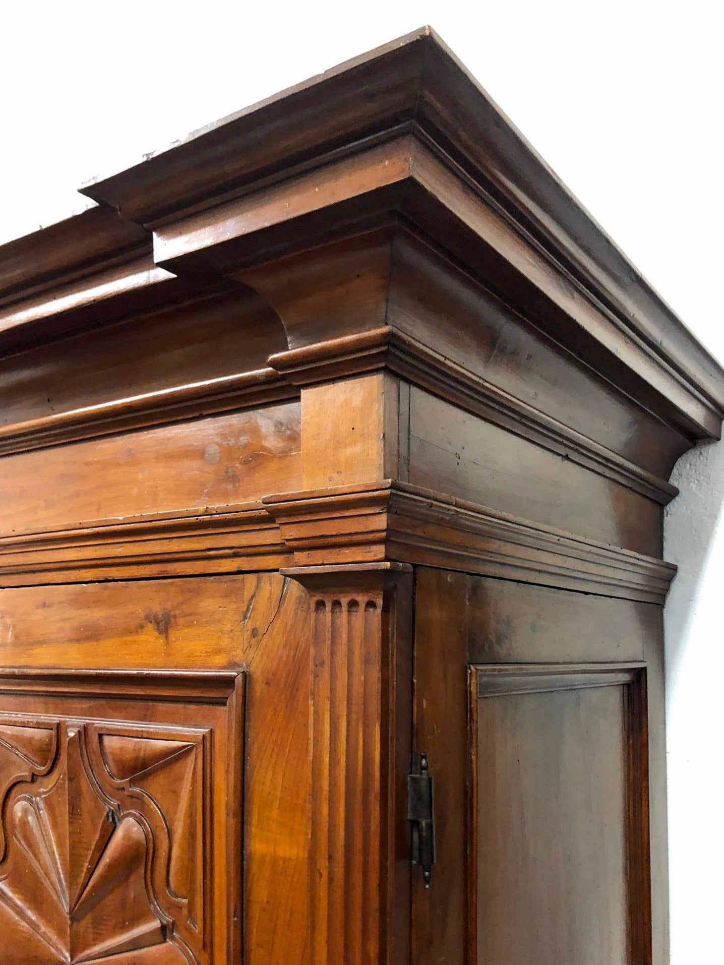 Walnut wardrobe carved with four-leaf clover Genoa late 17th century