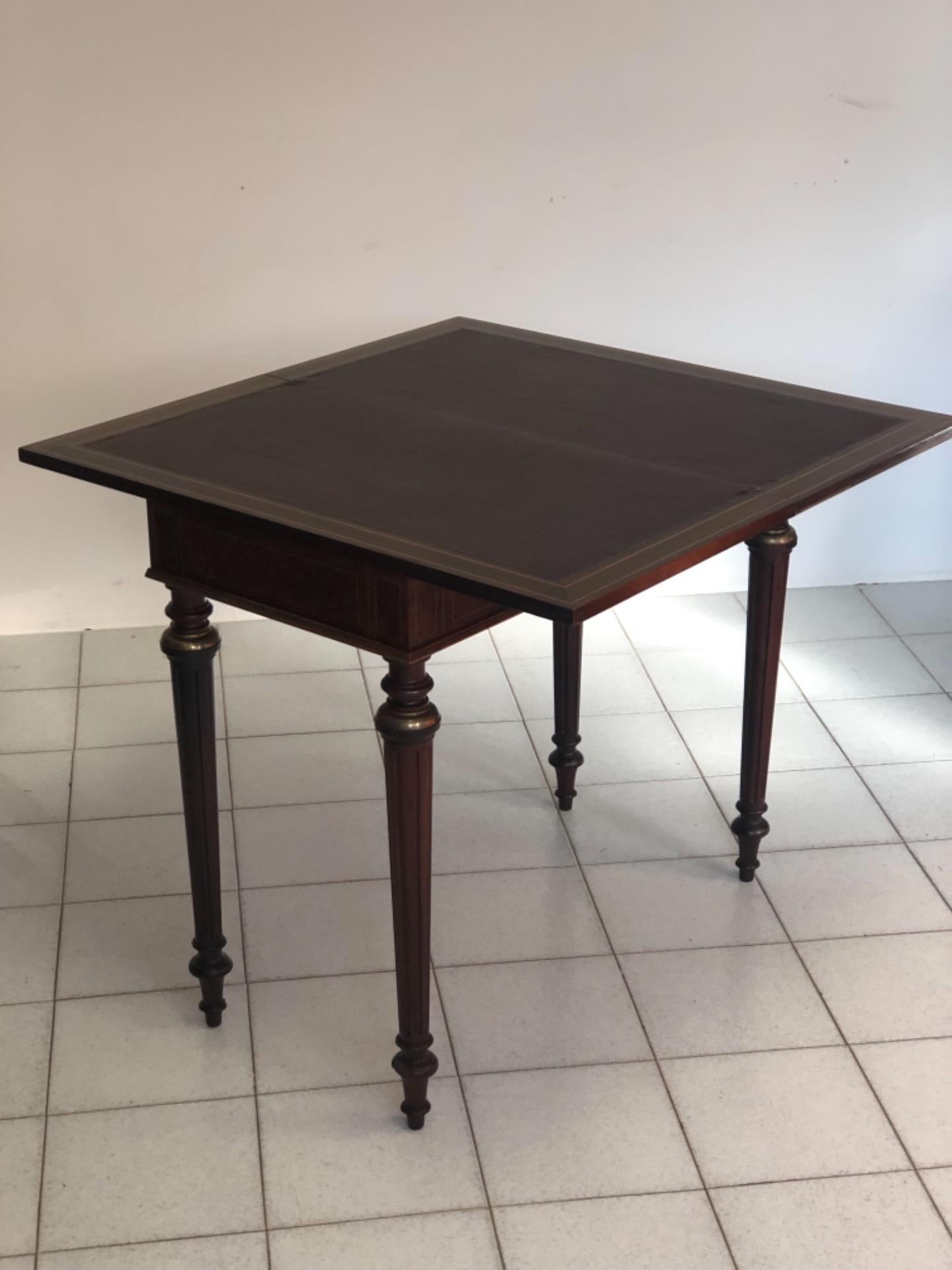 Inlaid veneered table. 19th century