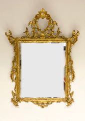 Specchiera in legno intagliato dorato a foglia . Venezia inizio XIX secolo