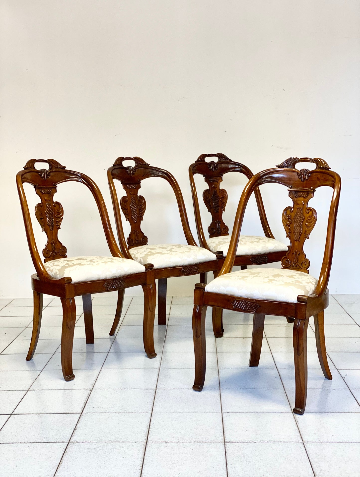 Group of four Lombard Charles X gondola empire chairs. Early 19th century