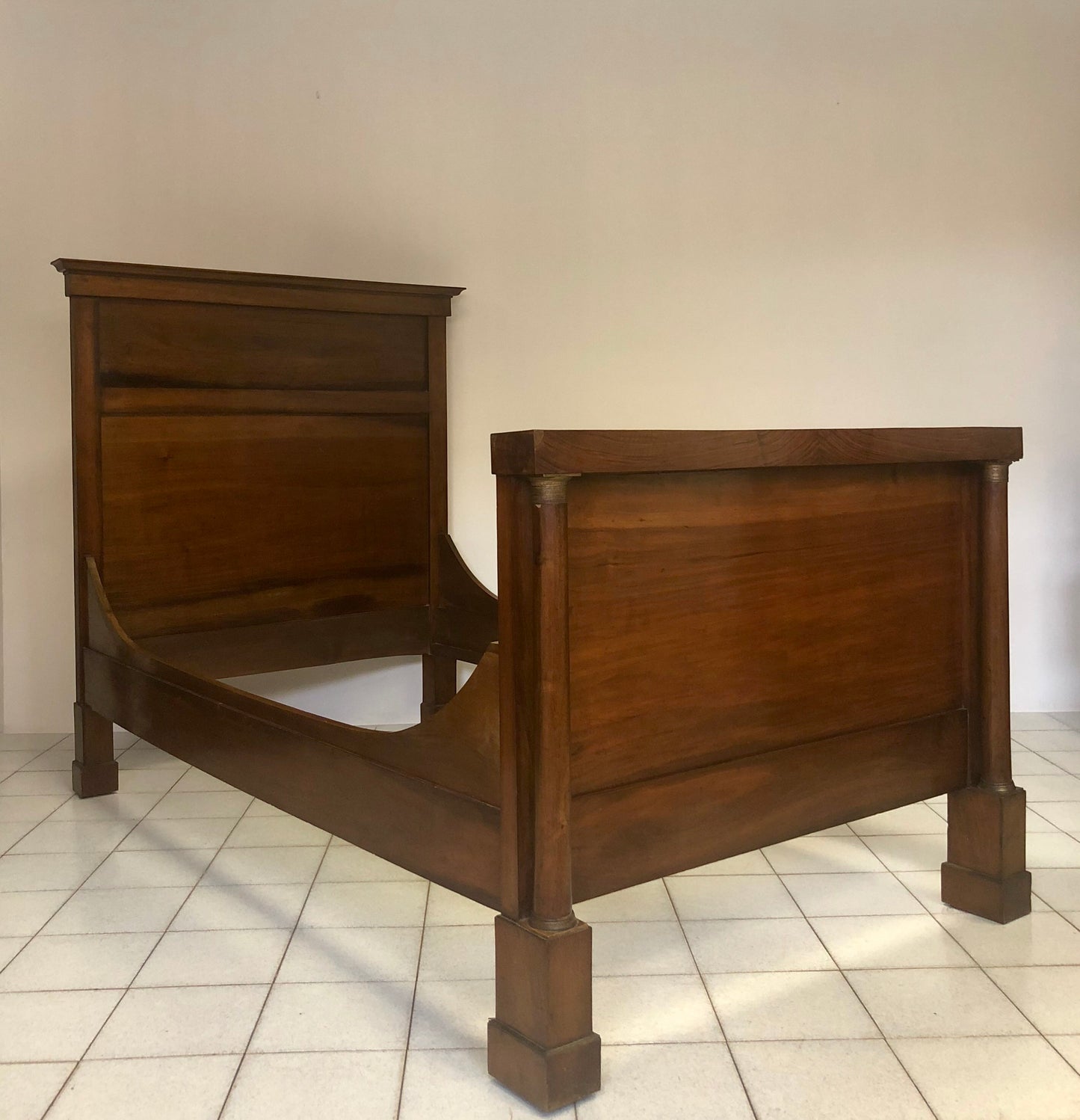 Lombard Empire three-quarter walnut bed. First half of the 19th century