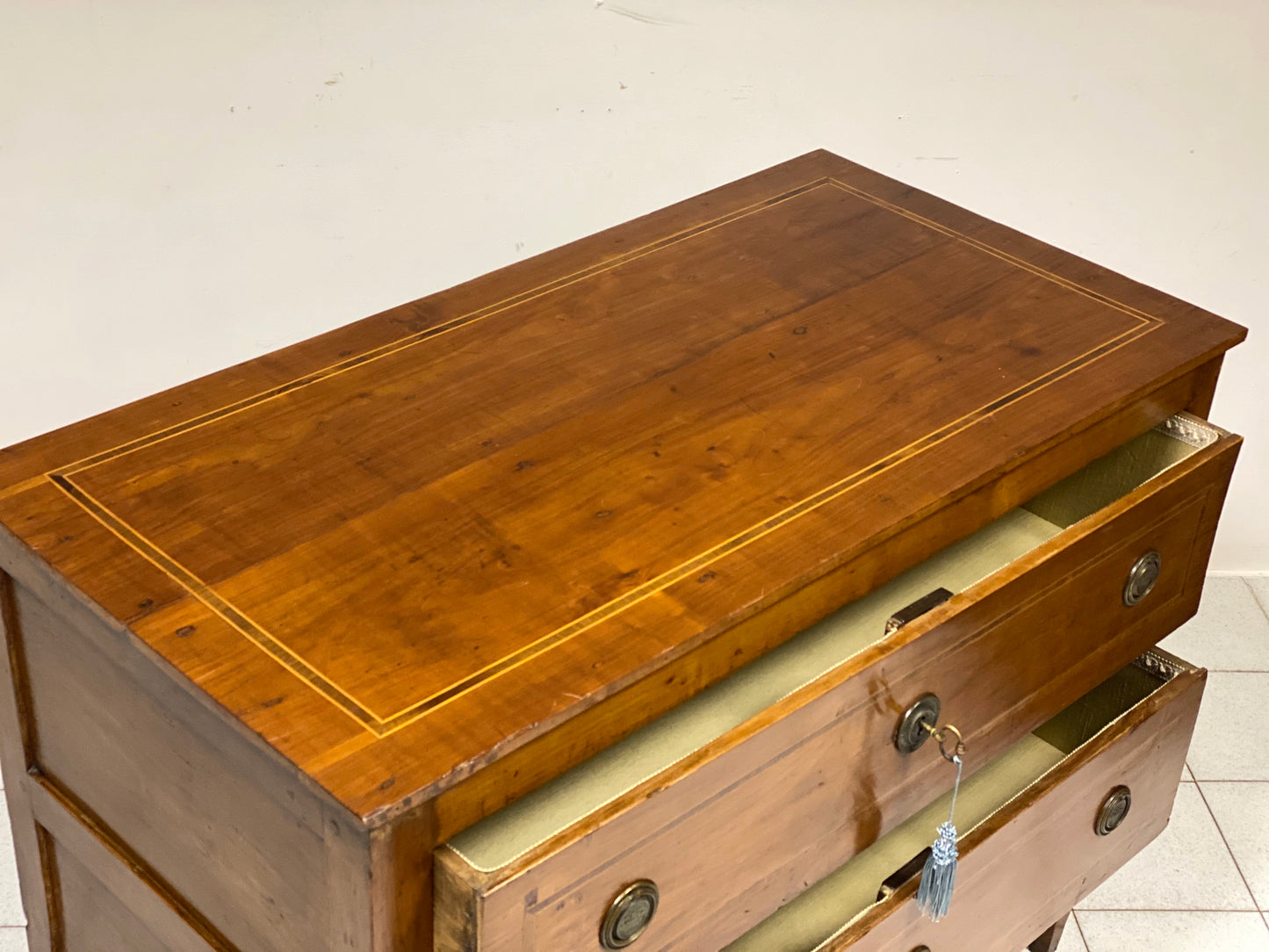 Inlaid cherry directorate chest of drawers. Lombardy, early 19th century