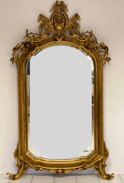 Specchiera in legno intagliato e dorato. Lombardia primo 800