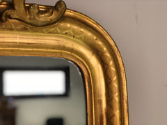 Specchiera in foglia oro zecchino con cimasa traforata
