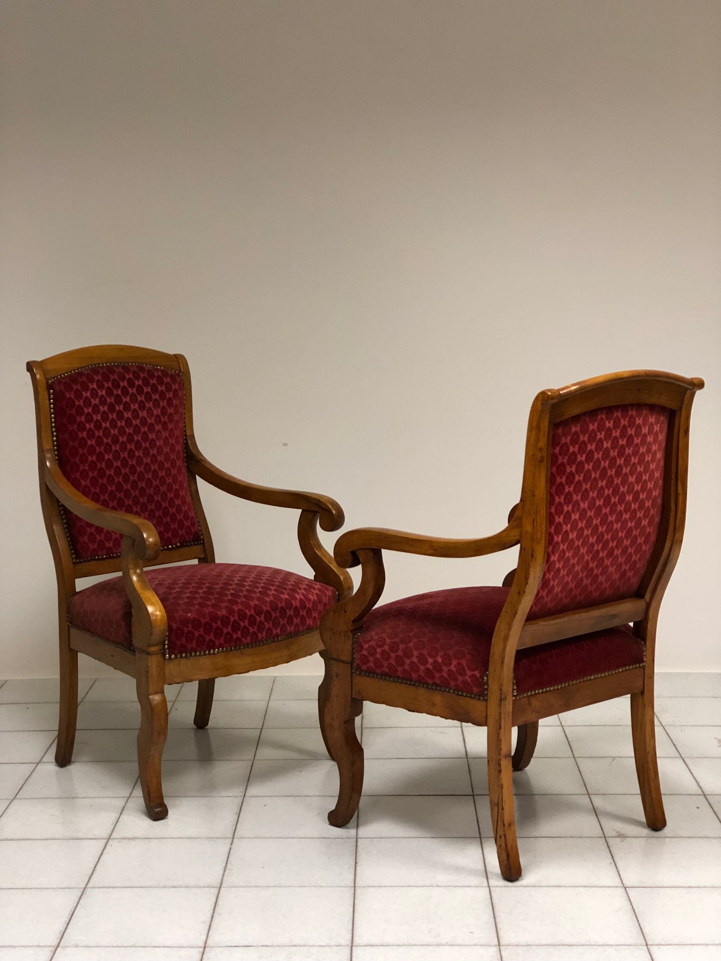 Pair of Empire walnut armchairs from the early 19th century