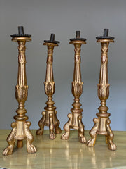 Gruppo di quattro candelieri in foglia oro . Lombardia epoca impero