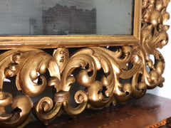 Specchiera in legno intagliato e dorato . Modena Bologna primi 700