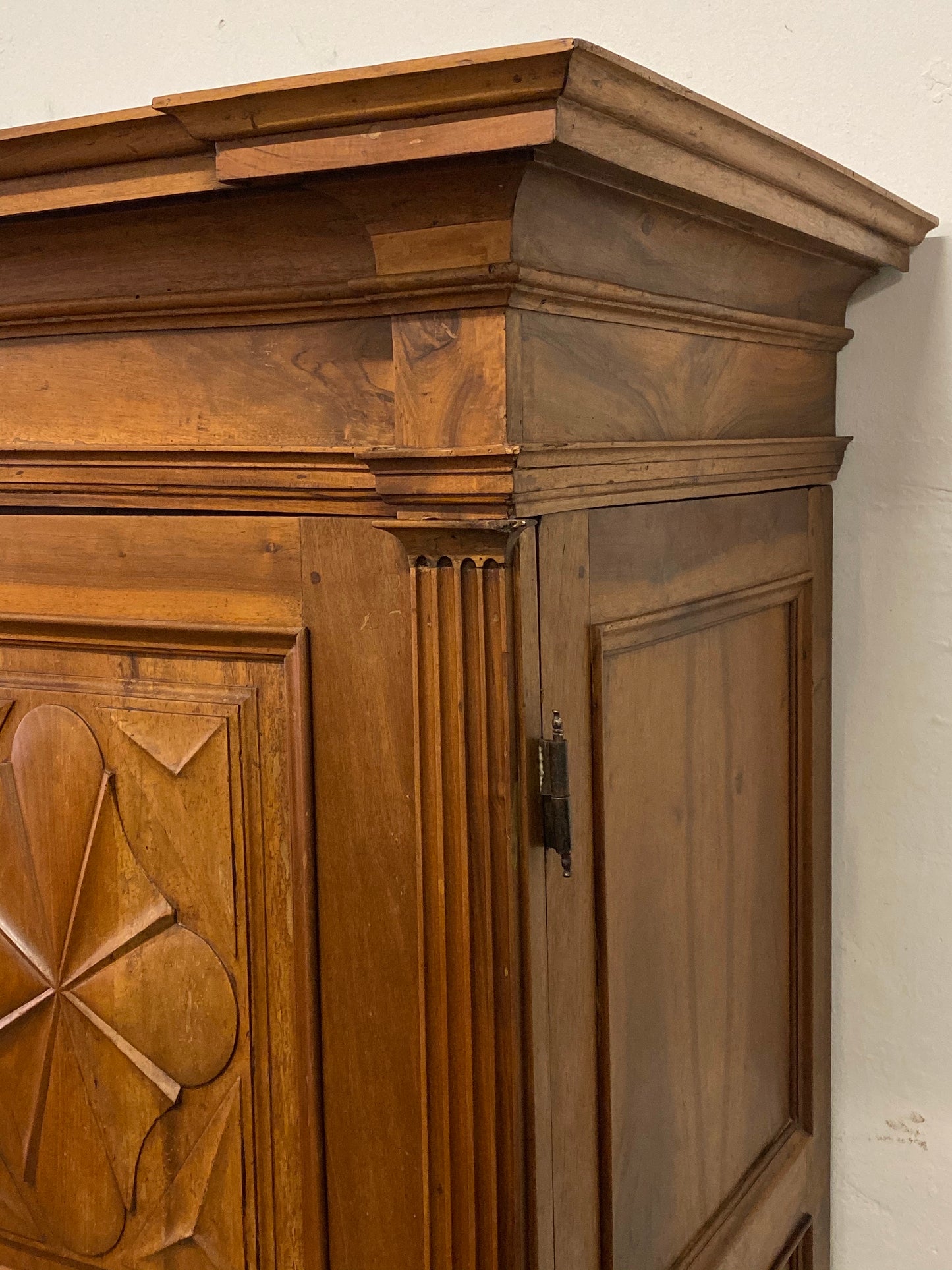 Walnut wardrobe carved with cloverleaf Genoa mid 18th century