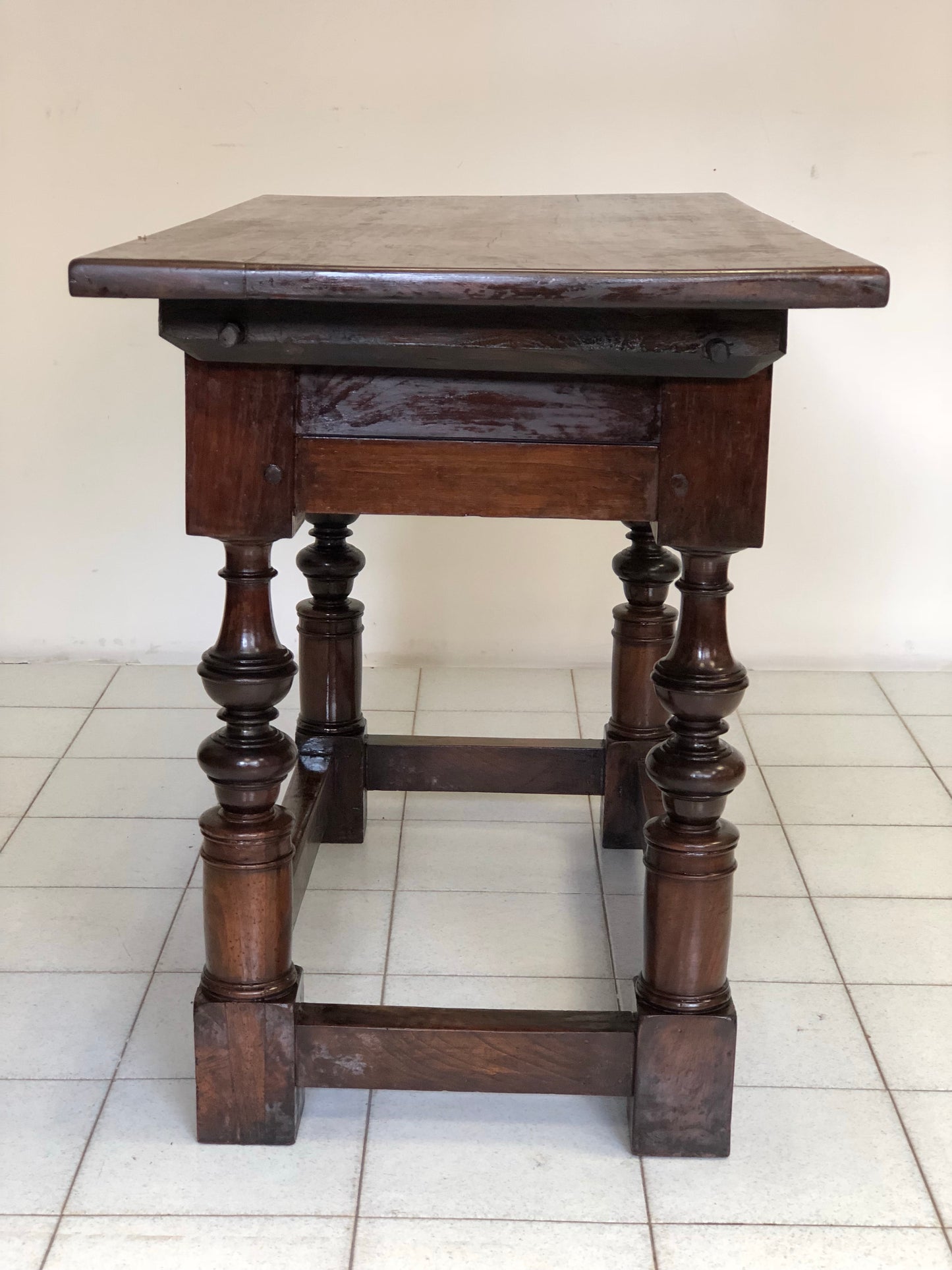 Bolognese walnut reel table. 17th century