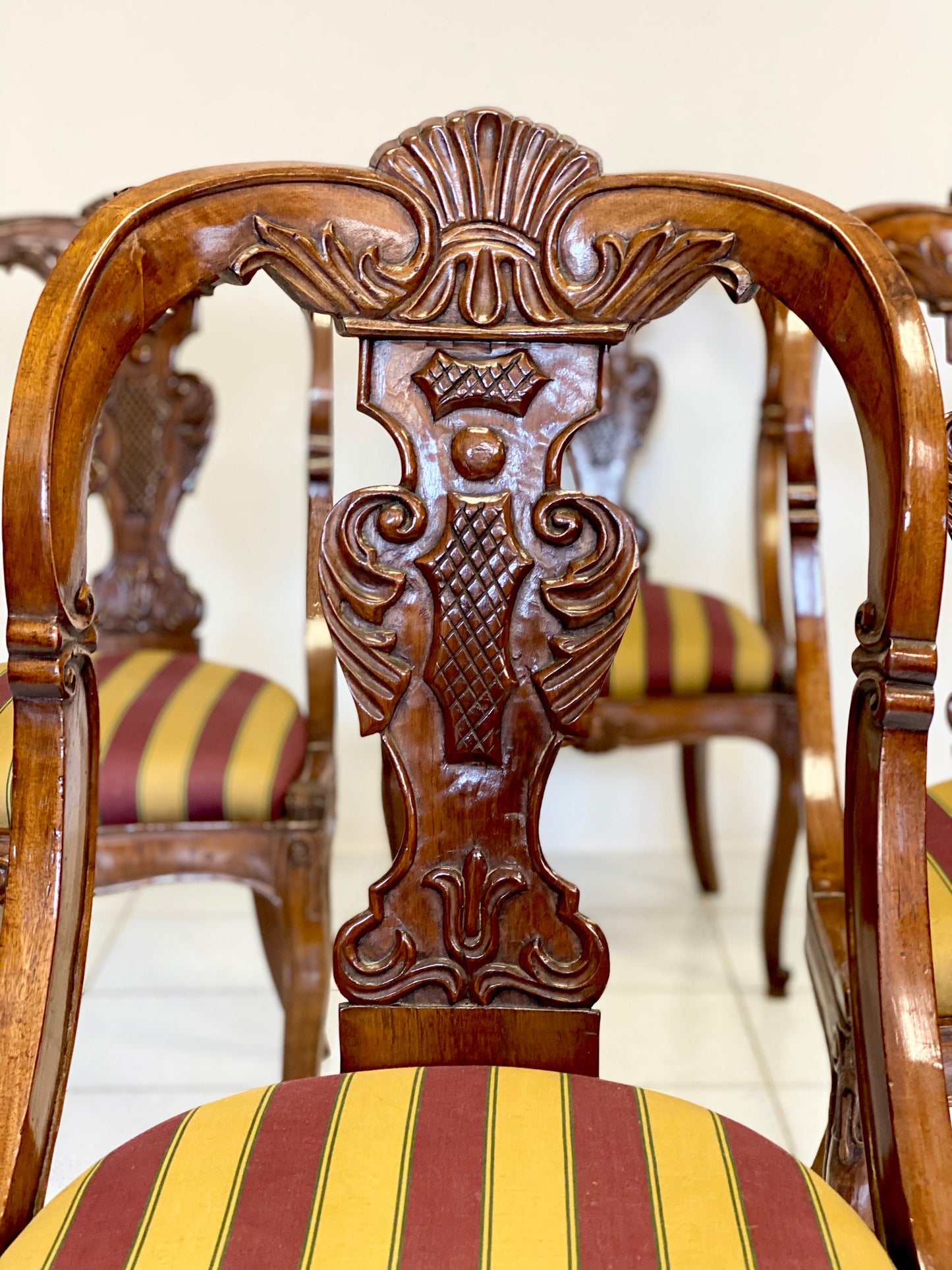 Group of four walnut gondola chairs. Early 19th century