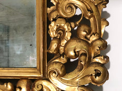 Specchiera in legno intagliato e dorato . Modena Bologna primi 700