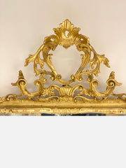 Specchiera in legno intagliato dorato a foglia . Venezia inizio XIX secolo
